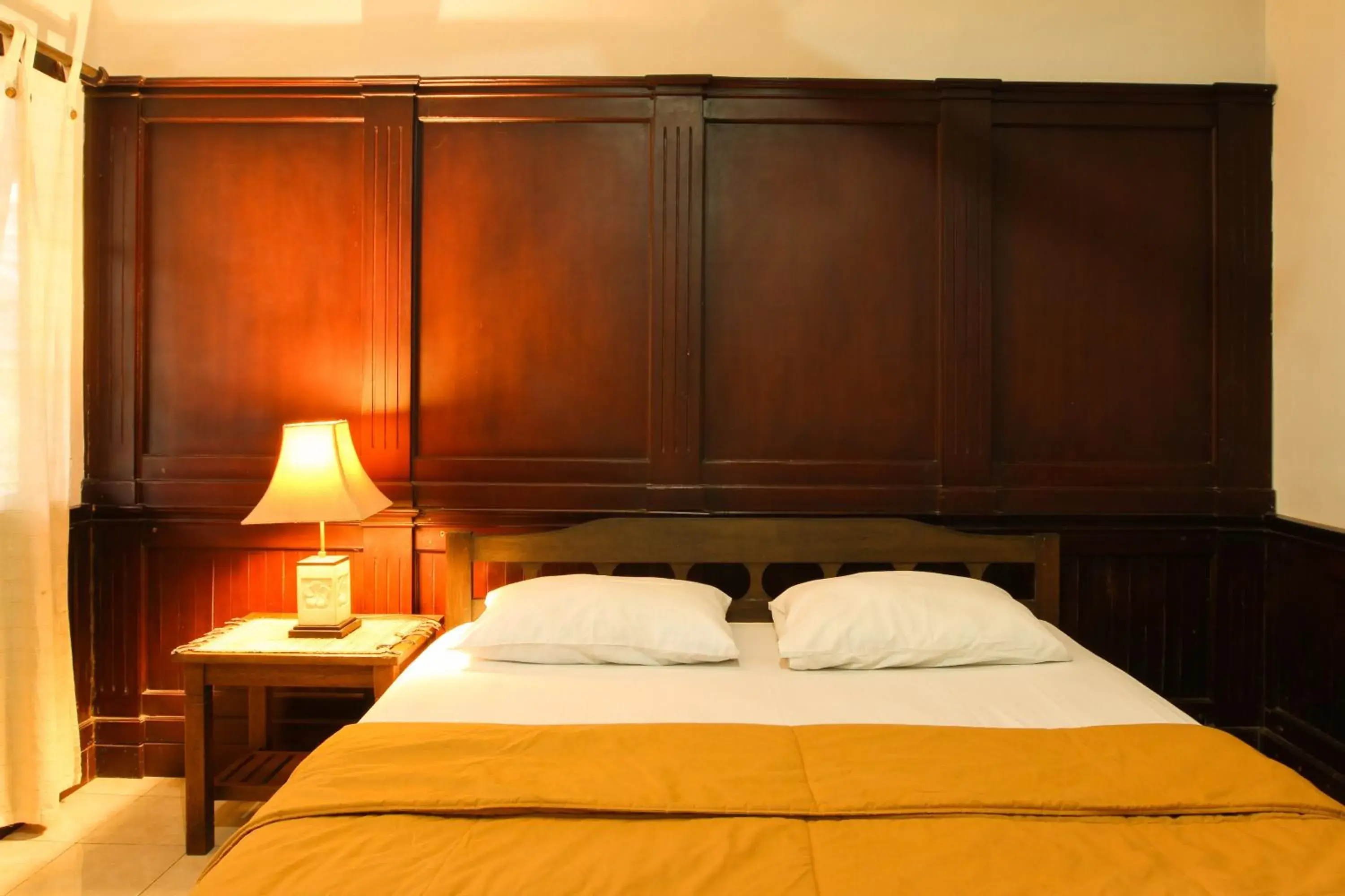 Bed in Sari Indah Cottages Bed in Sari Indah Cottages