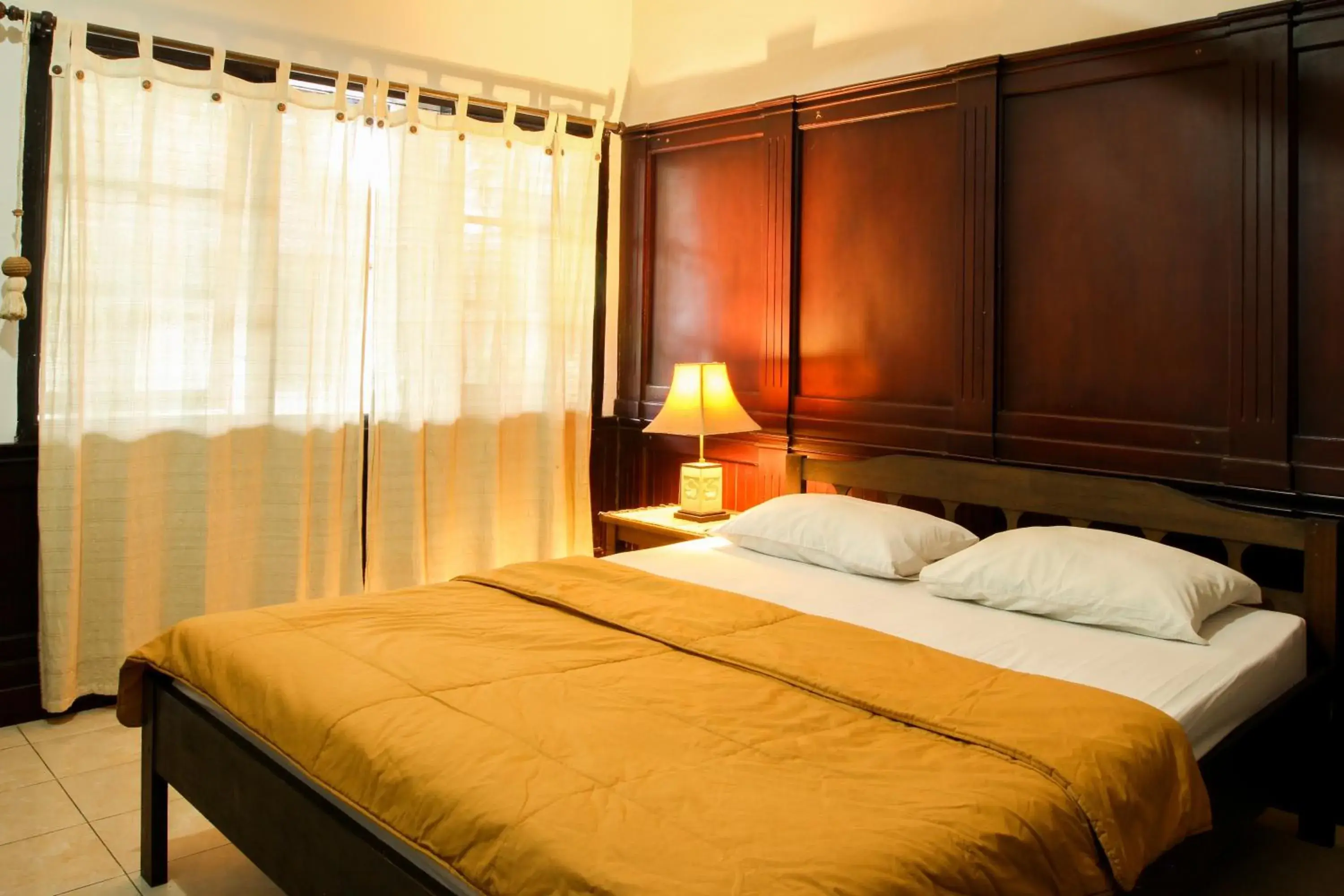 Bed in Sari Indah Cottages Bed in Sari Indah Cottages