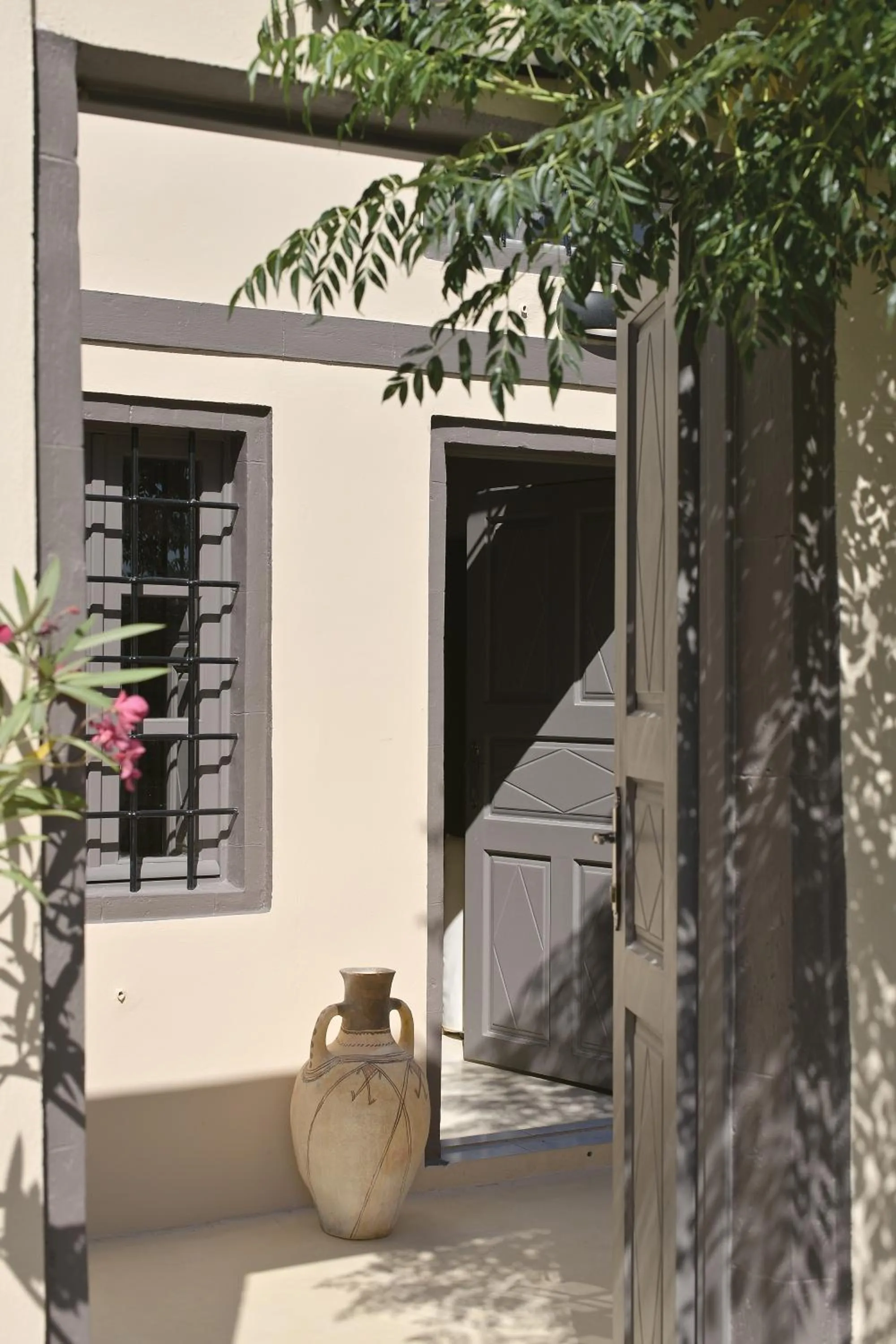 Facade/entrance in OIA UNIQUE HOMES by K&K