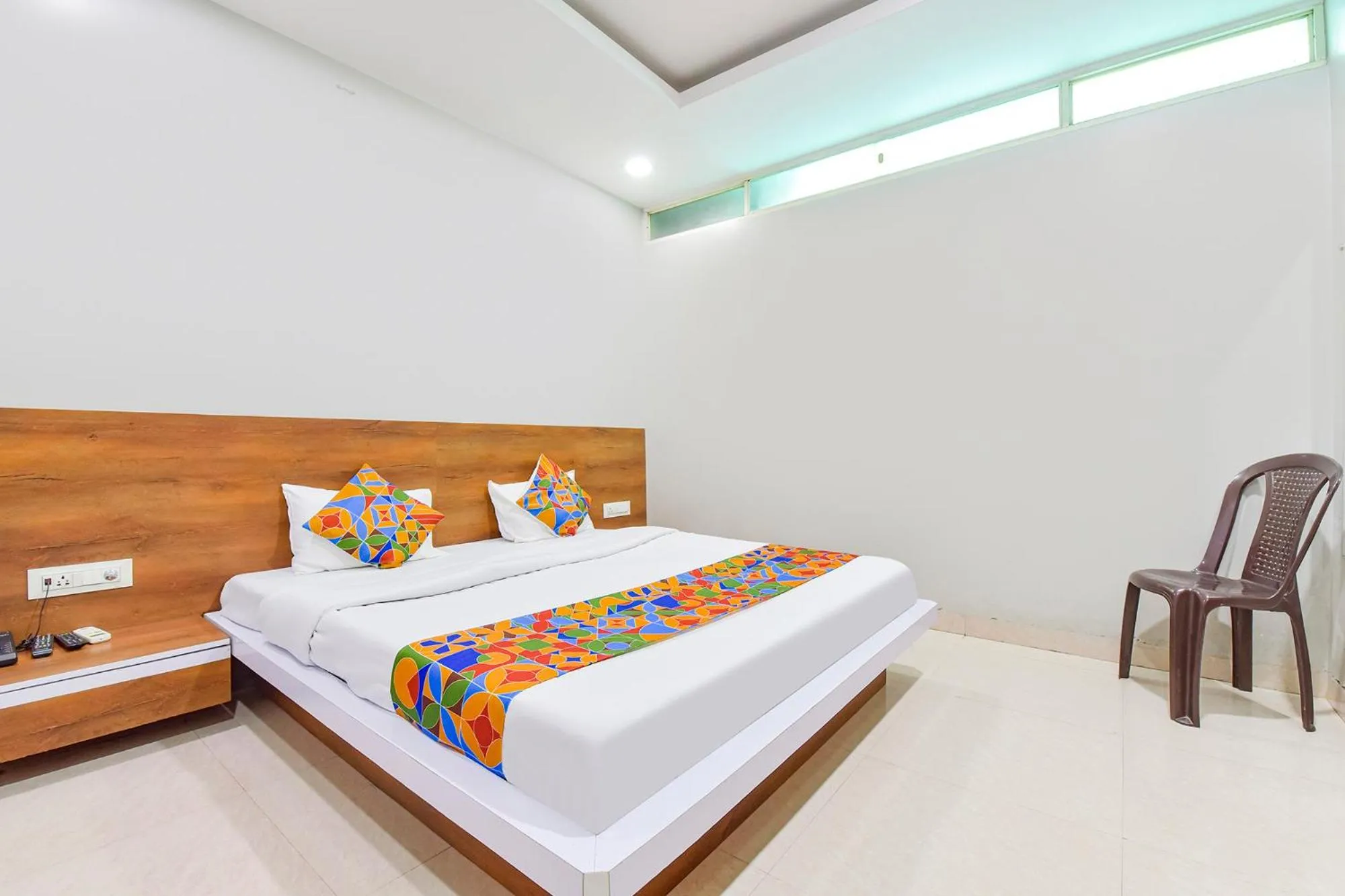 Bed in FabHotel Raghumani Palace - Nr Mahakal Mandir