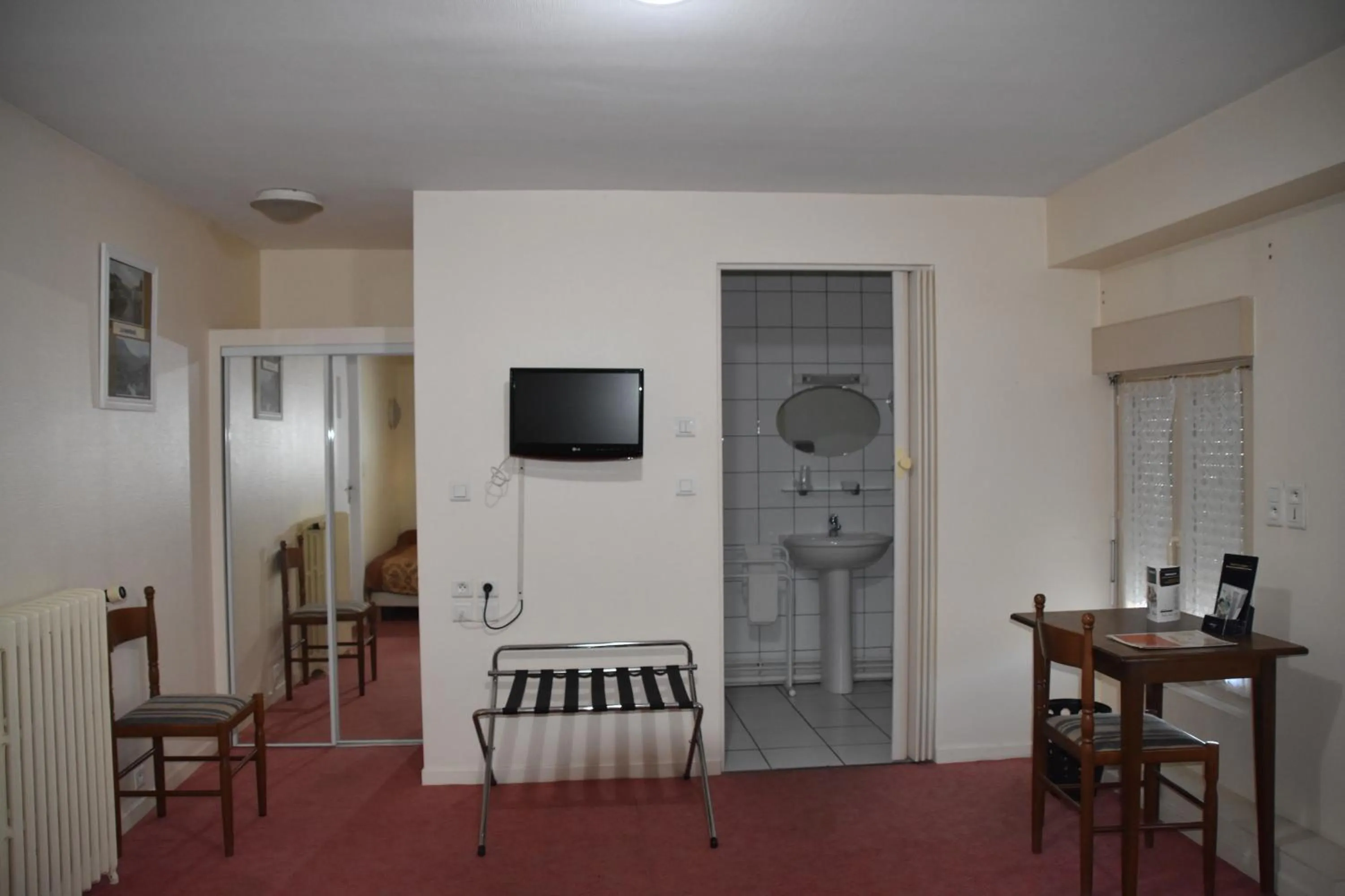 Bedroom in Hôtel Le Rider