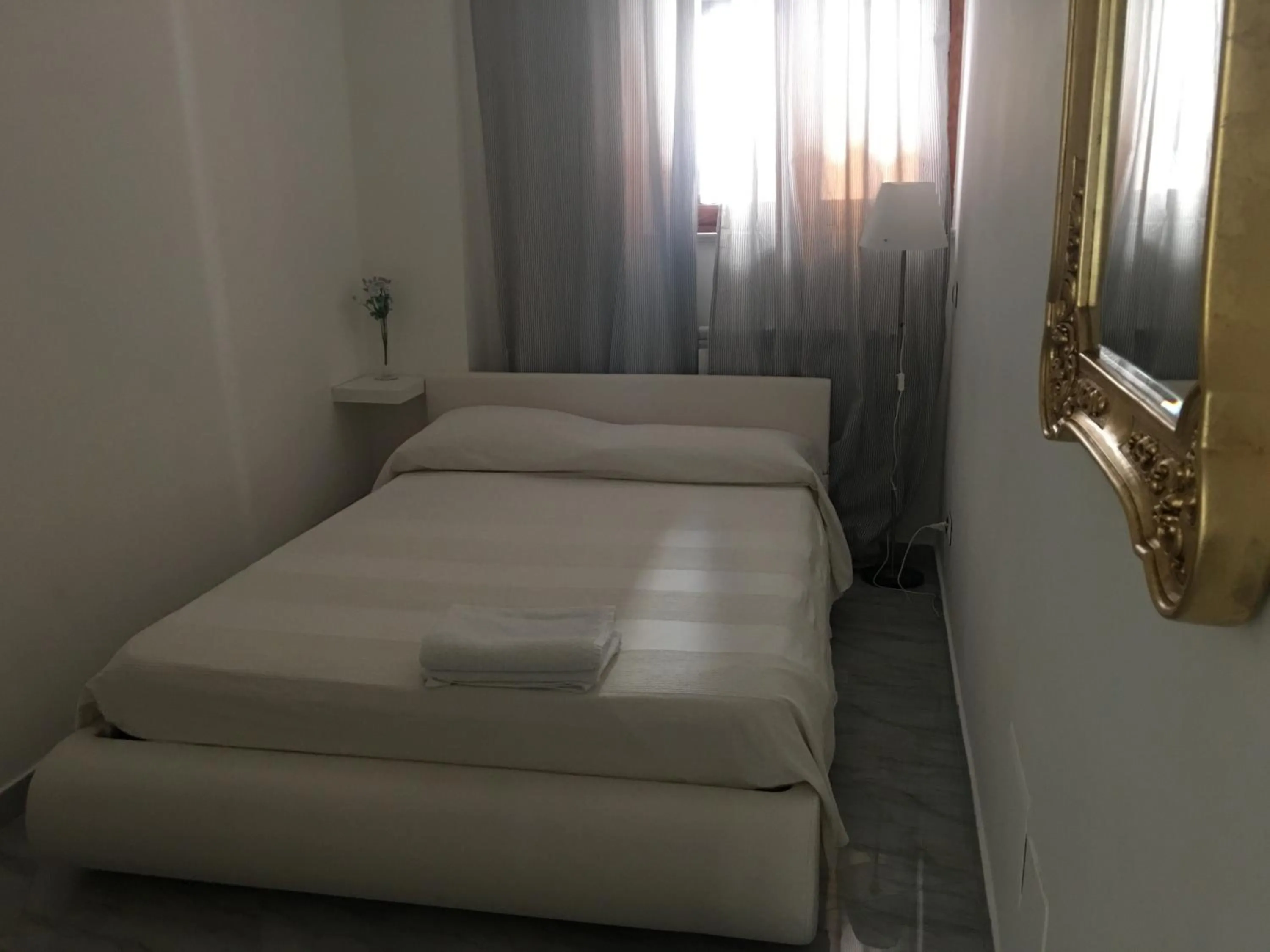 Bed in Supera Napoli Apartment