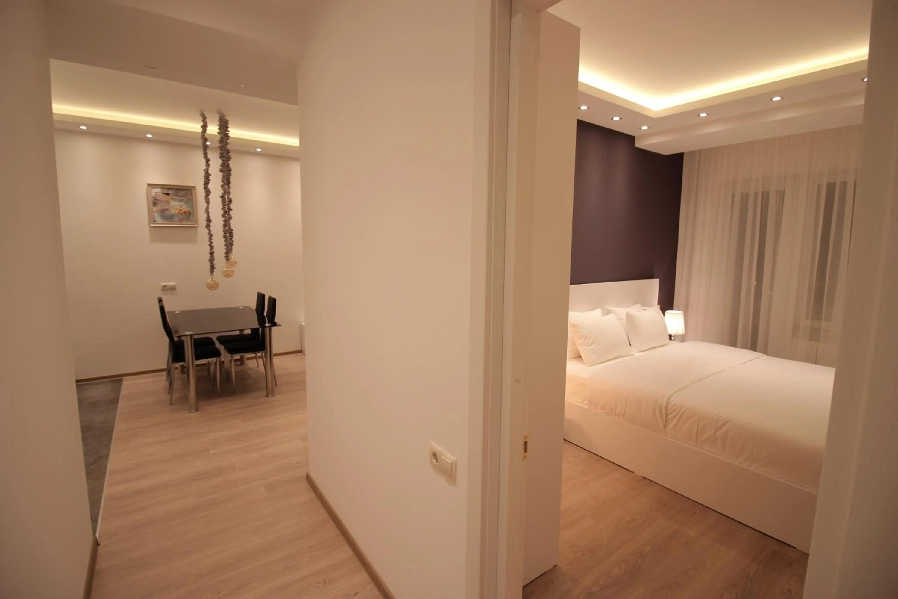 Dining area, Bed in Maxela Apartments