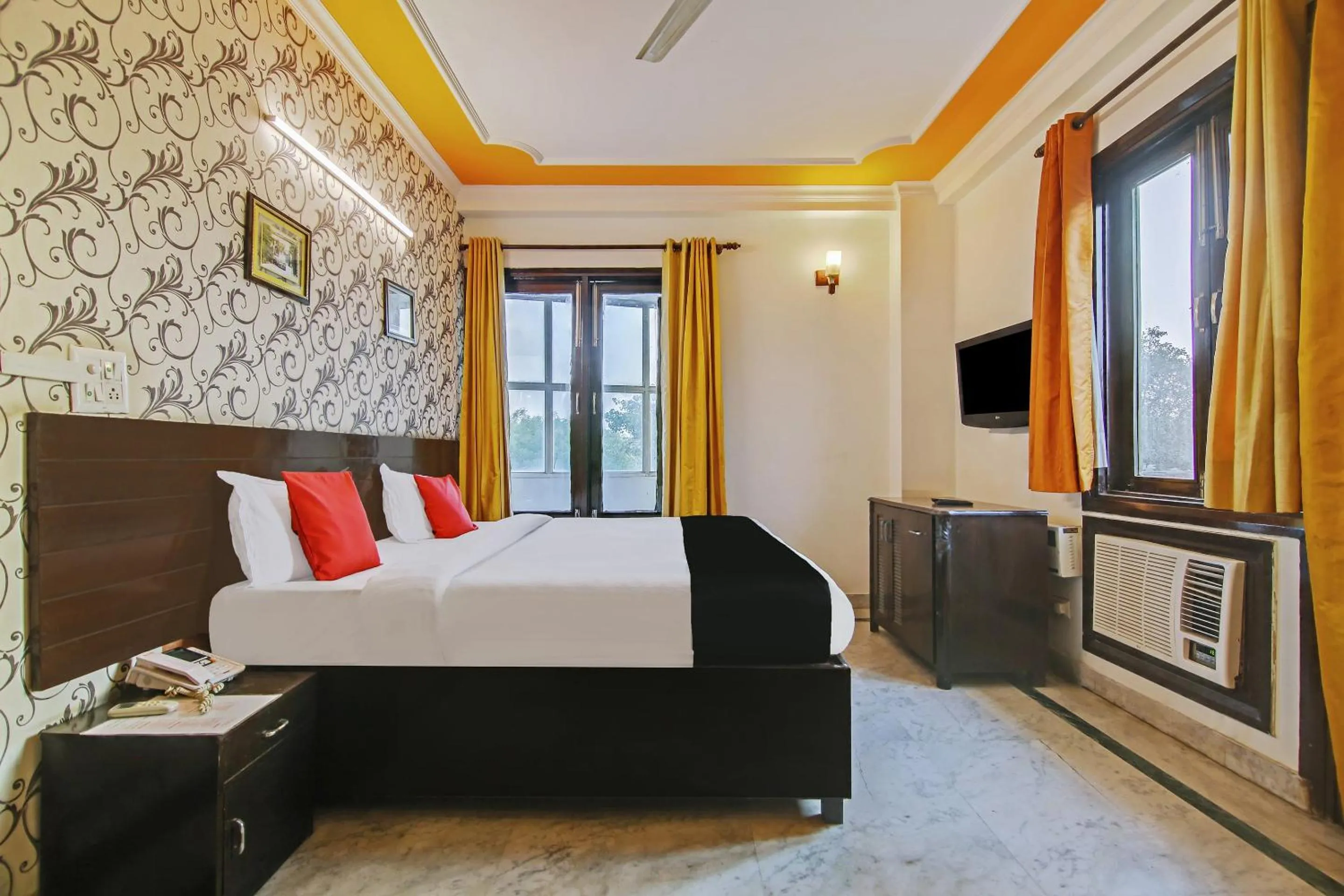 Bedroom in Capital O Tipsyy Near Aravali Biodiversity Park