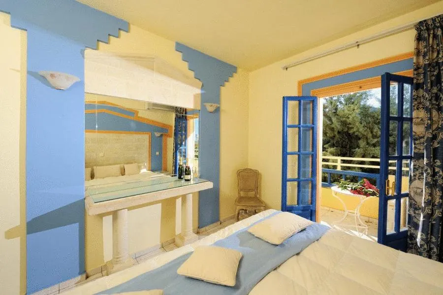 Bedroom in Parthenis Hotel & Suites
