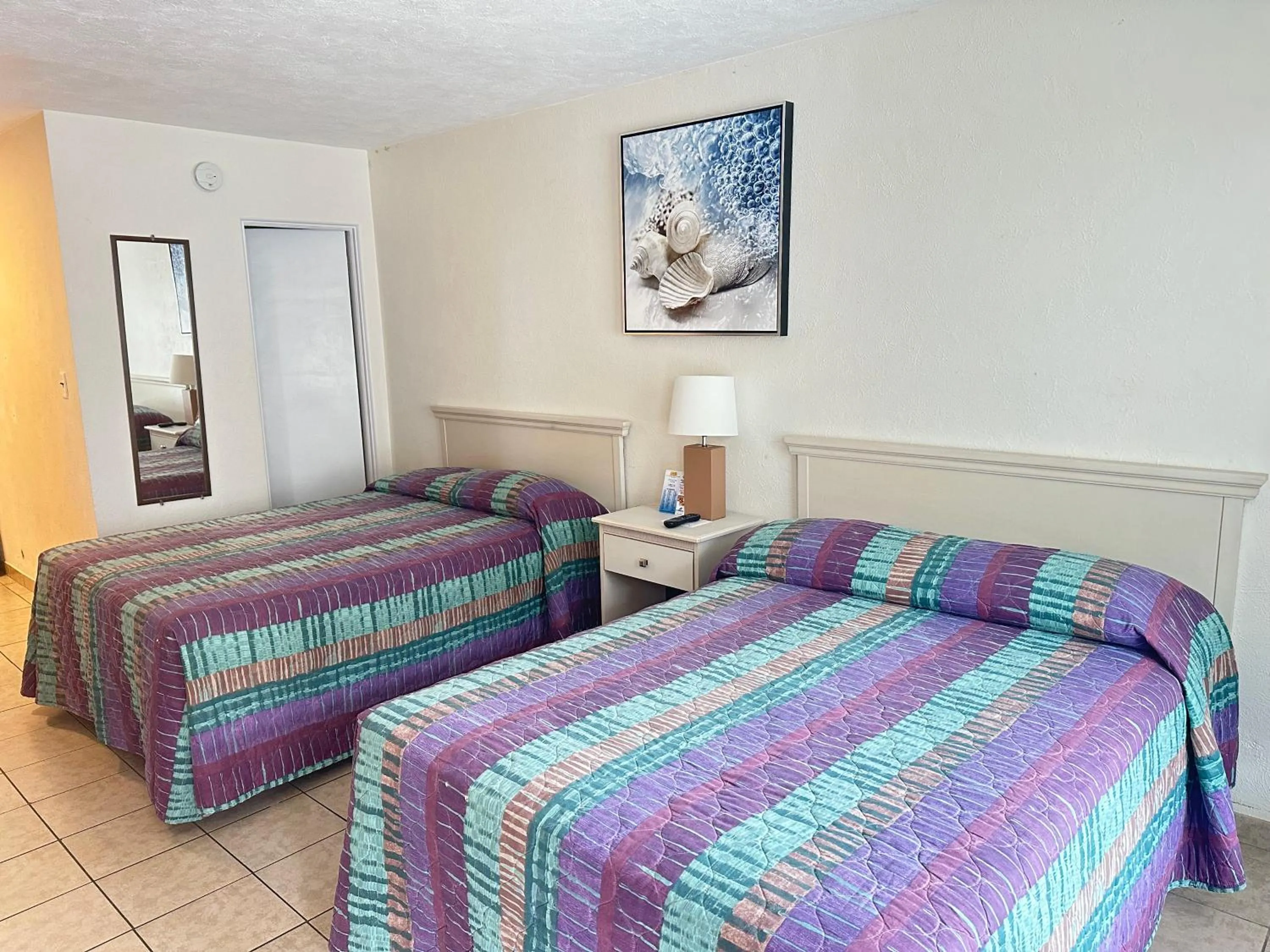 Bed in Beach Colony Motel