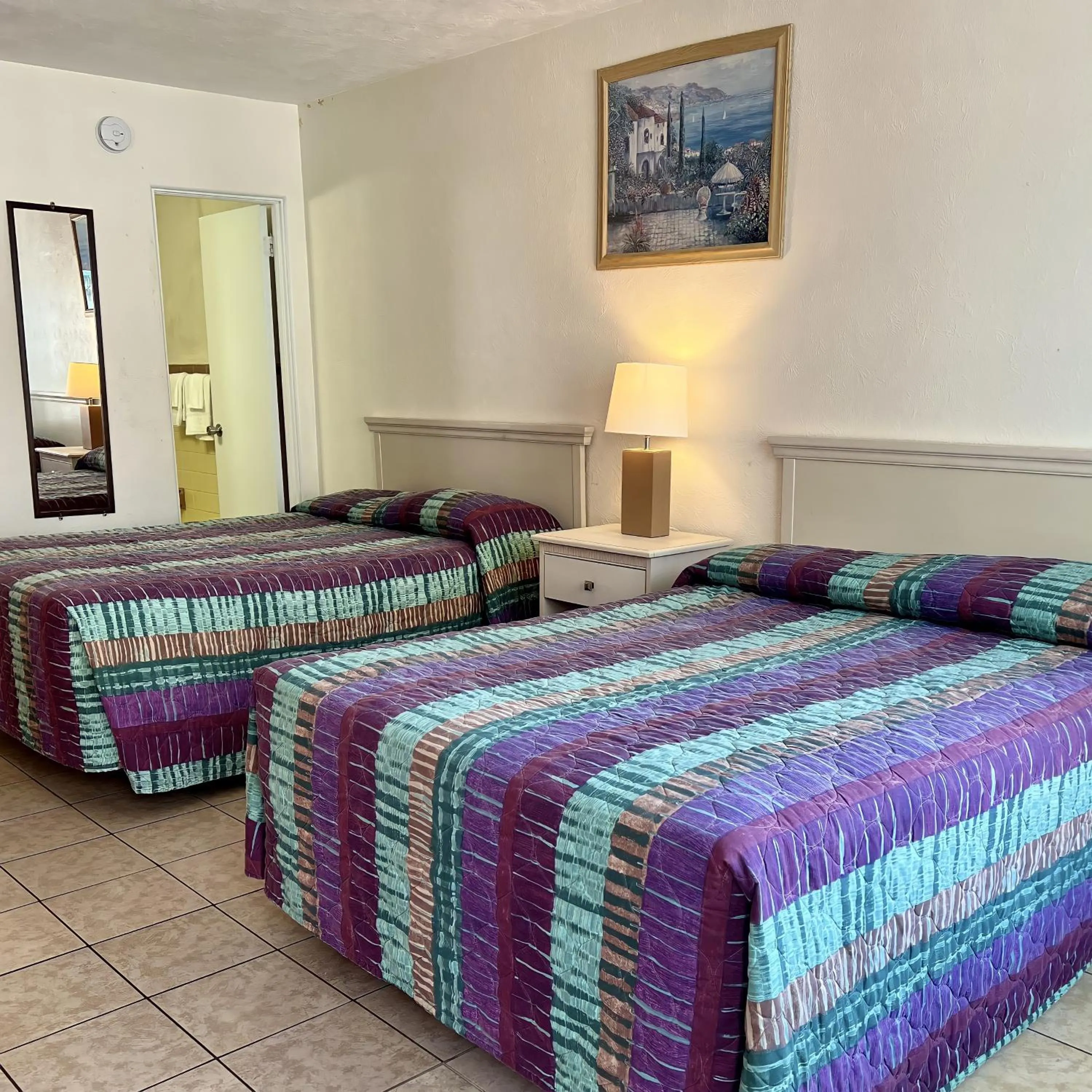 Bed in Beach Colony Motel