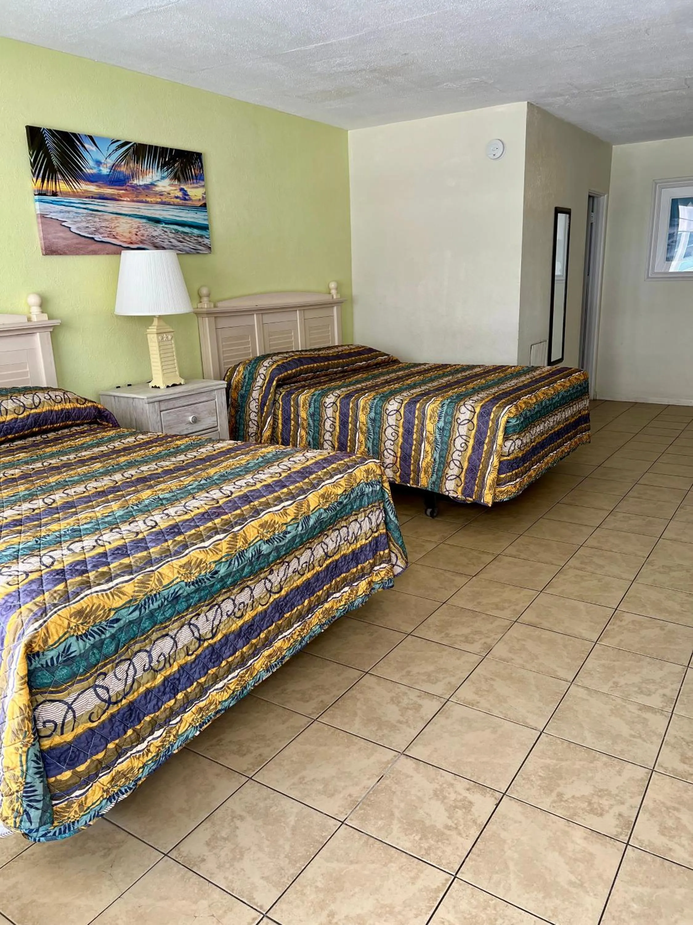 Bed in Beach Colony Motel