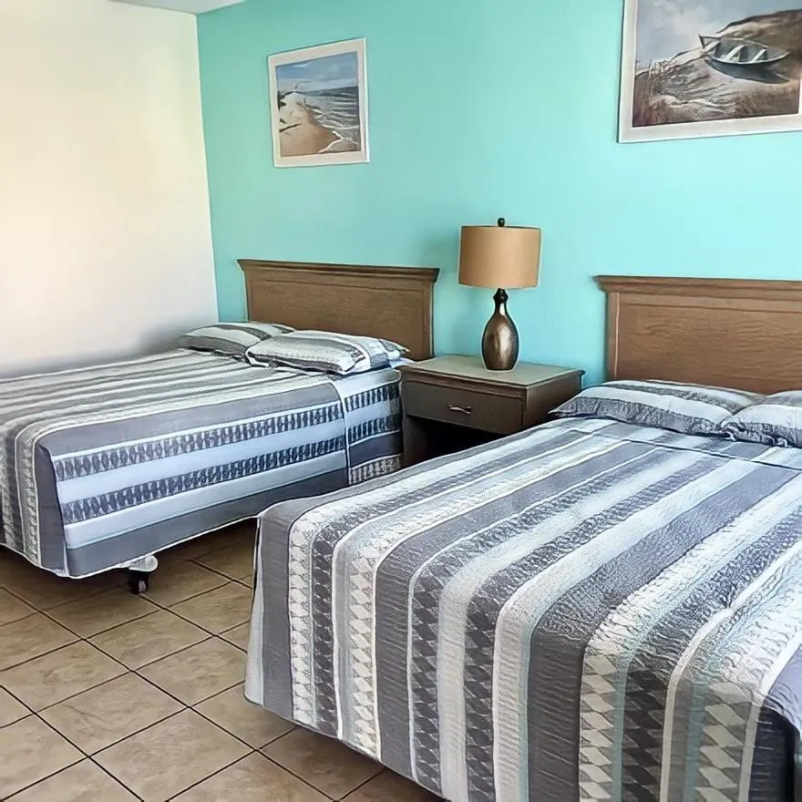 Bed in Beach Colony Motel