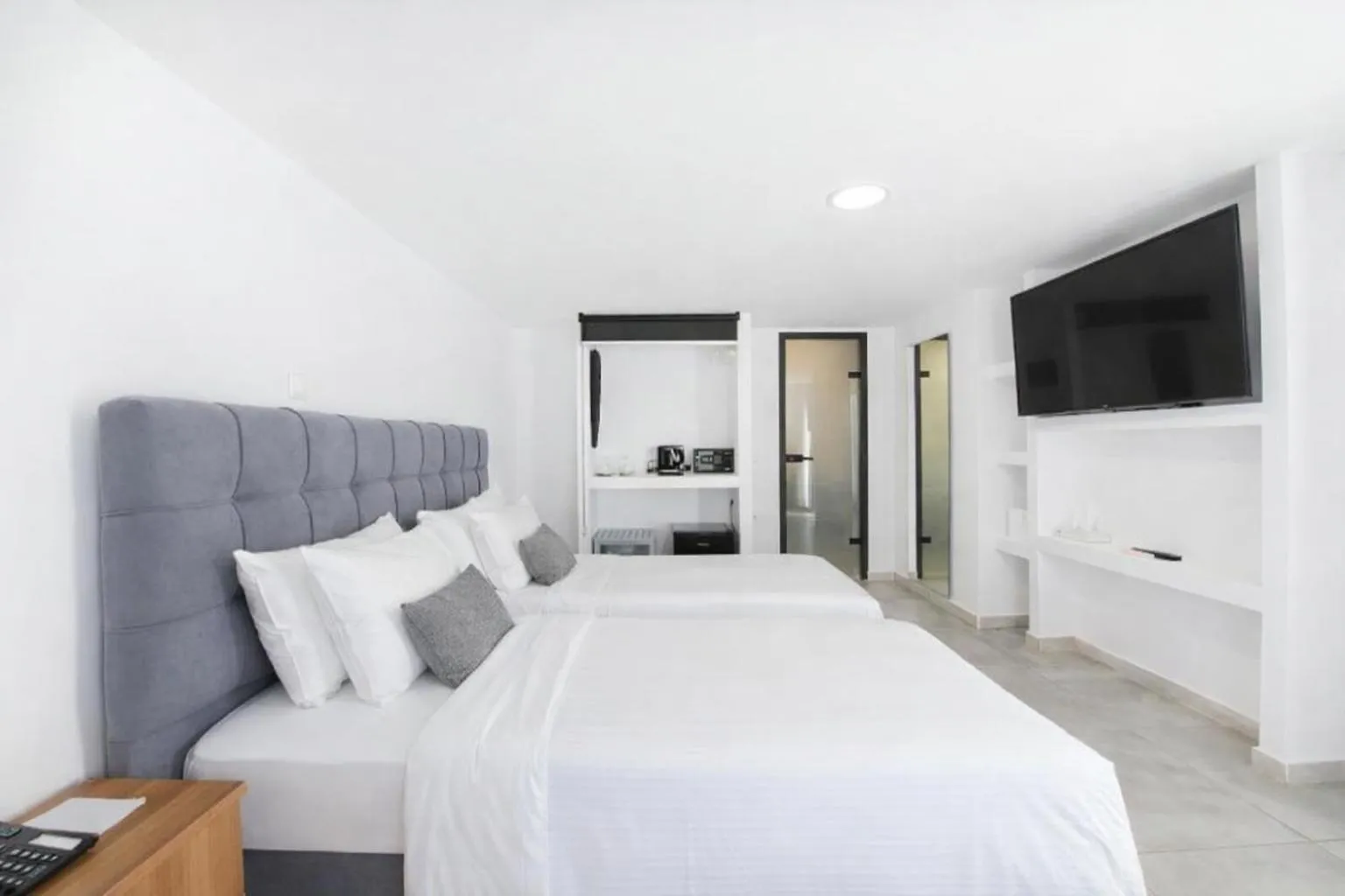 Bed in Mykonos Kosmoplaz Beach Resort Hotel