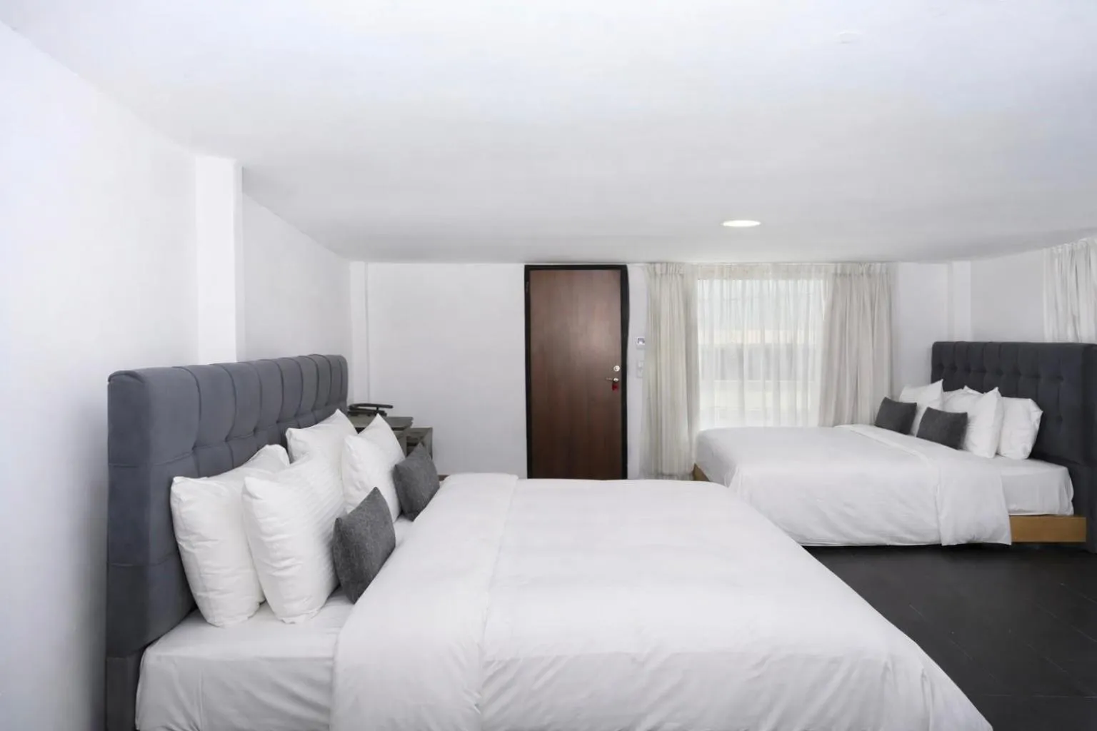 Bed in Mykonos Kosmoplaz Beach Resort Hotel