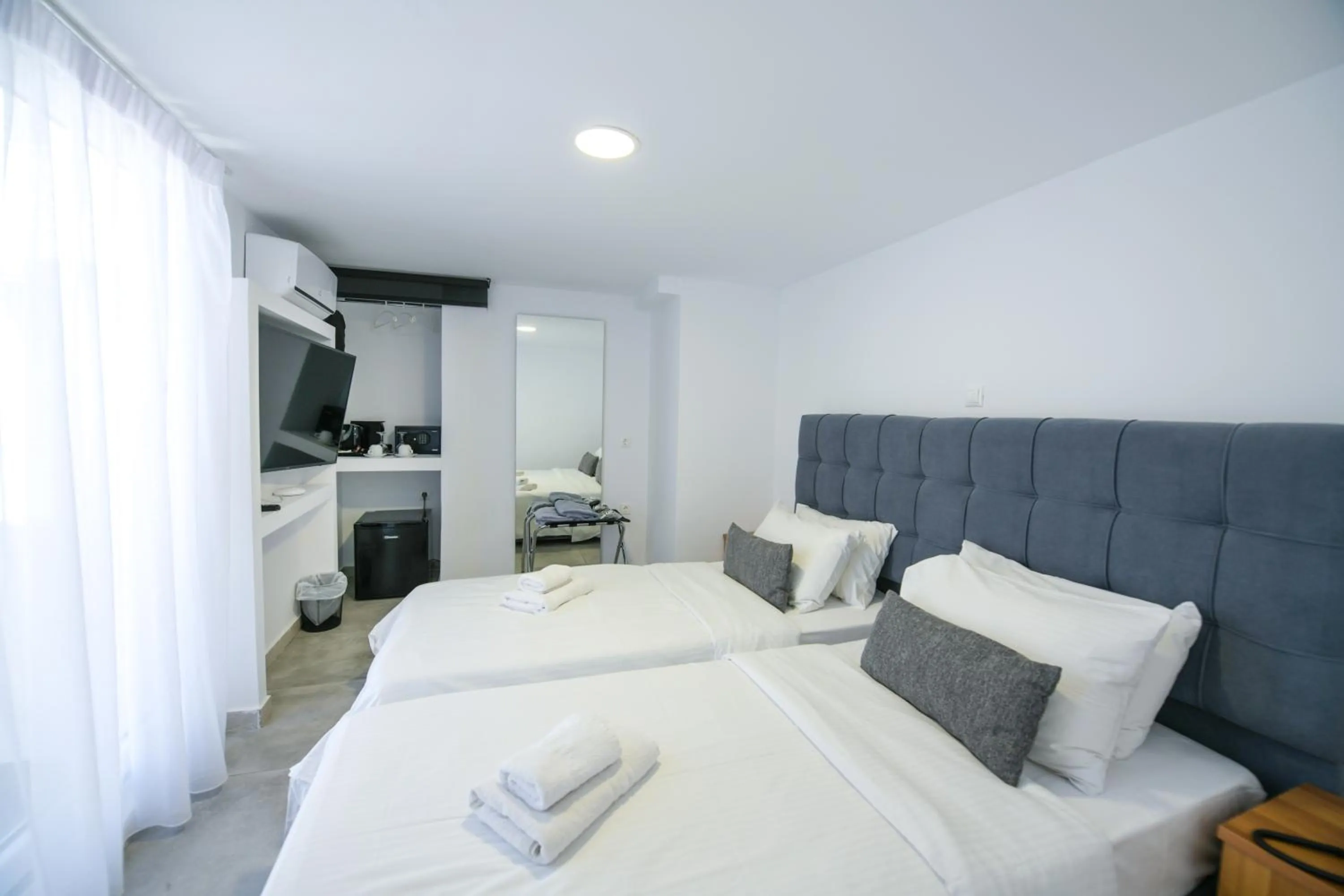 Bed in Mykonos Kosmoplaz Beach Resort Hotel