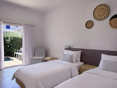 Bed in Mykonos Kosmoplaz Beach Resort Hotel