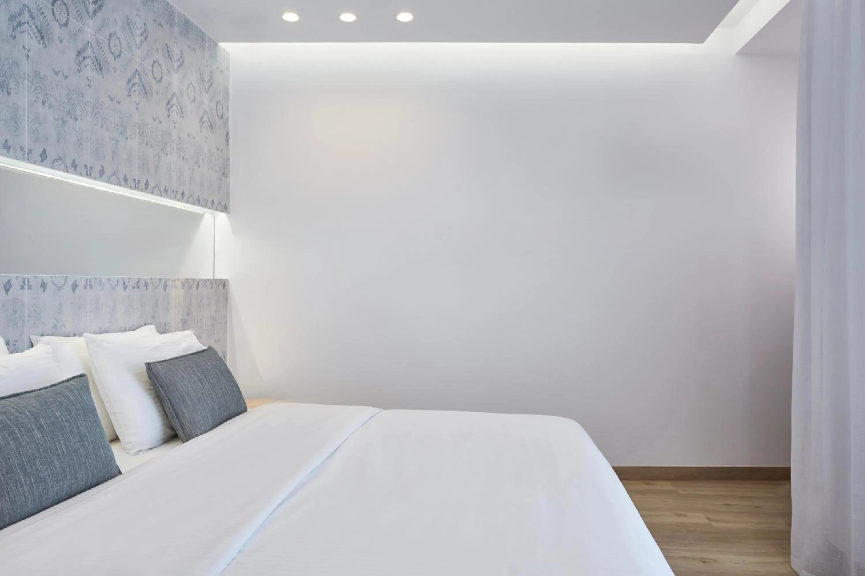 Bed in Mykonos Kosmoplaz Beach Resort Hotel