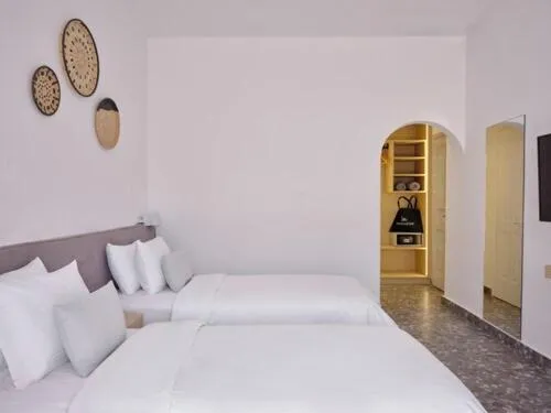 Bed in Mykonos Kosmoplaz Beach Resort Hotel