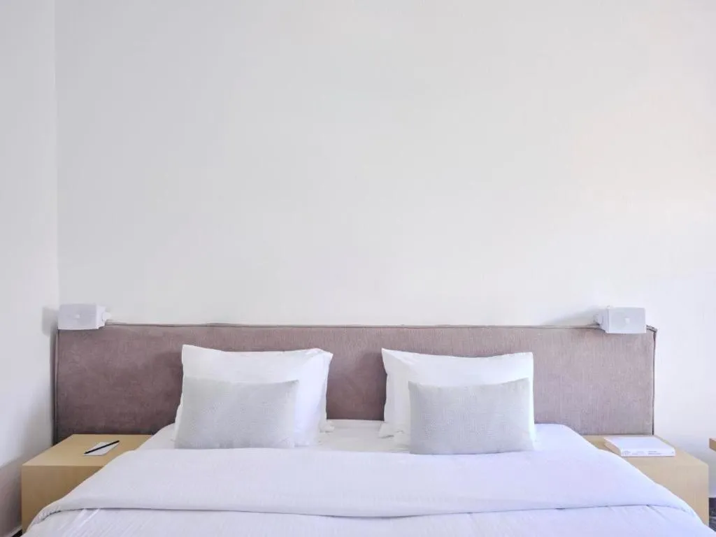 Bed in Mykonos Kosmoplaz Beach Resort Hotel