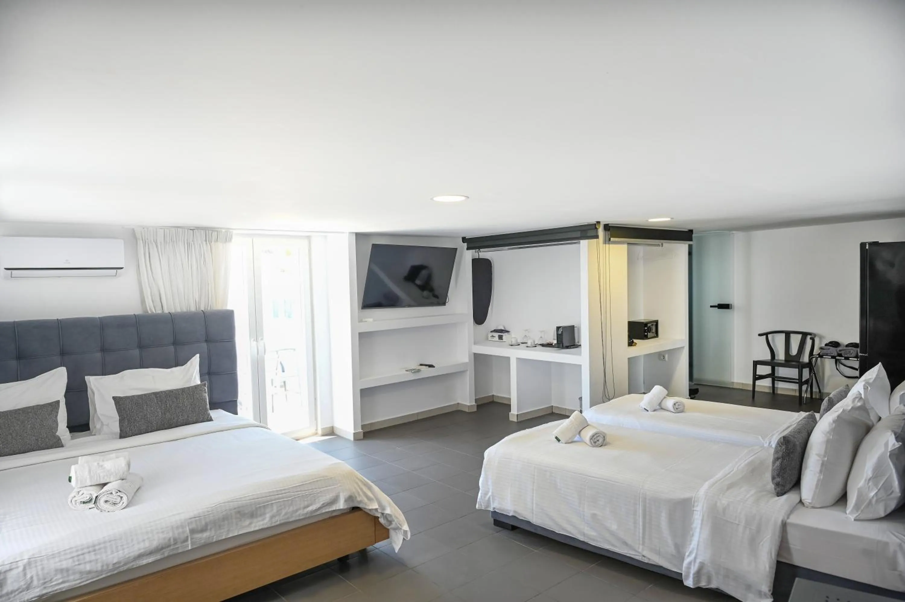 Bed in Mykonos Kosmoplaz Beach Resort Hotel