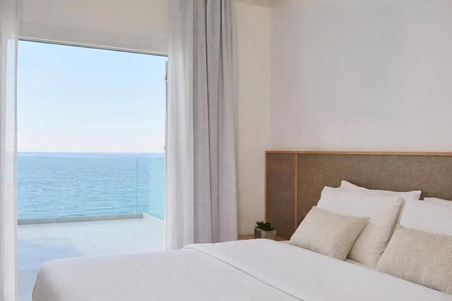 Bed in Mykonos Kosmoplaz Beach Resort Hotel