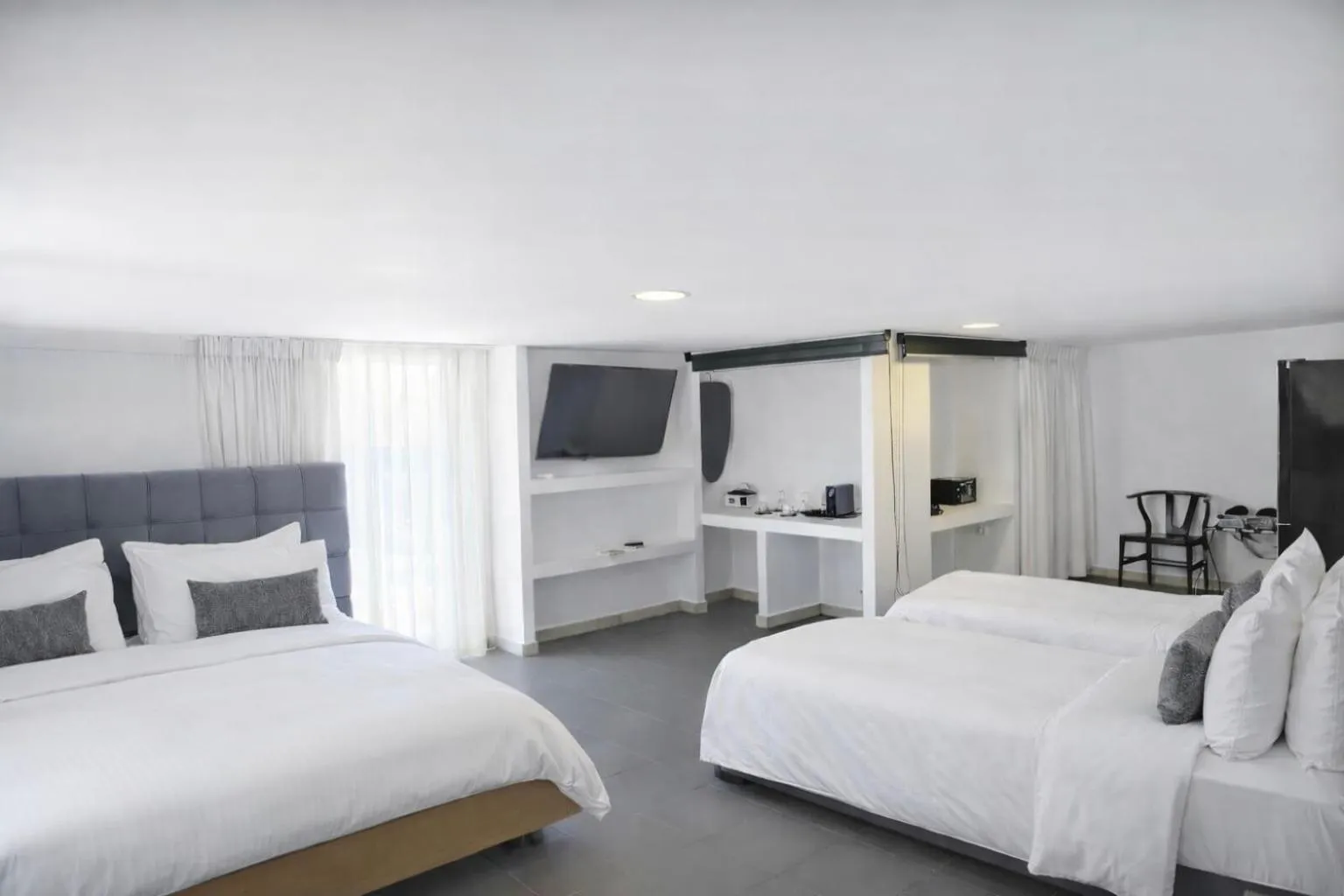 Bed in Mykonos Kosmoplaz Beach Resort Hotel