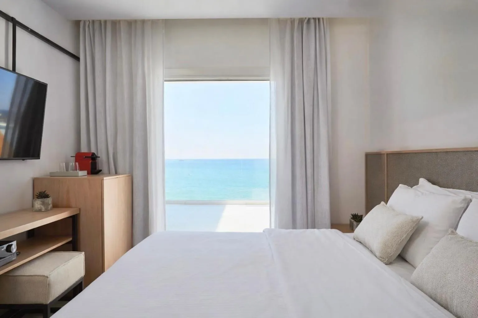 Bed in Mykonos Kosmoplaz Beach Resort Hotel