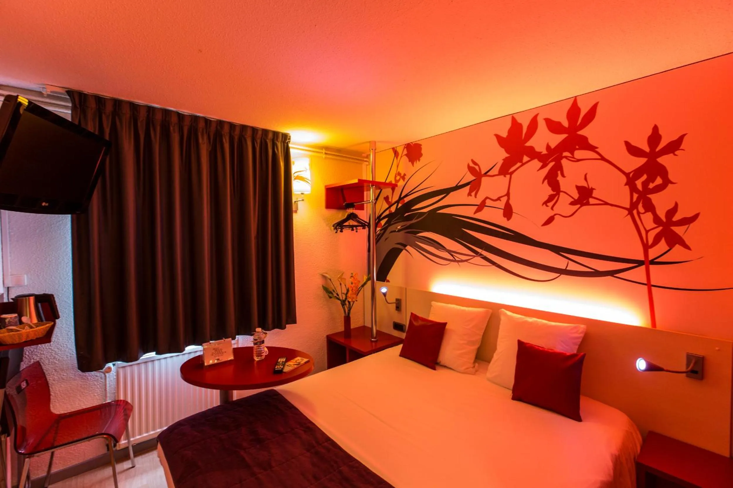 Bed in Hotel Inn Design Sedan