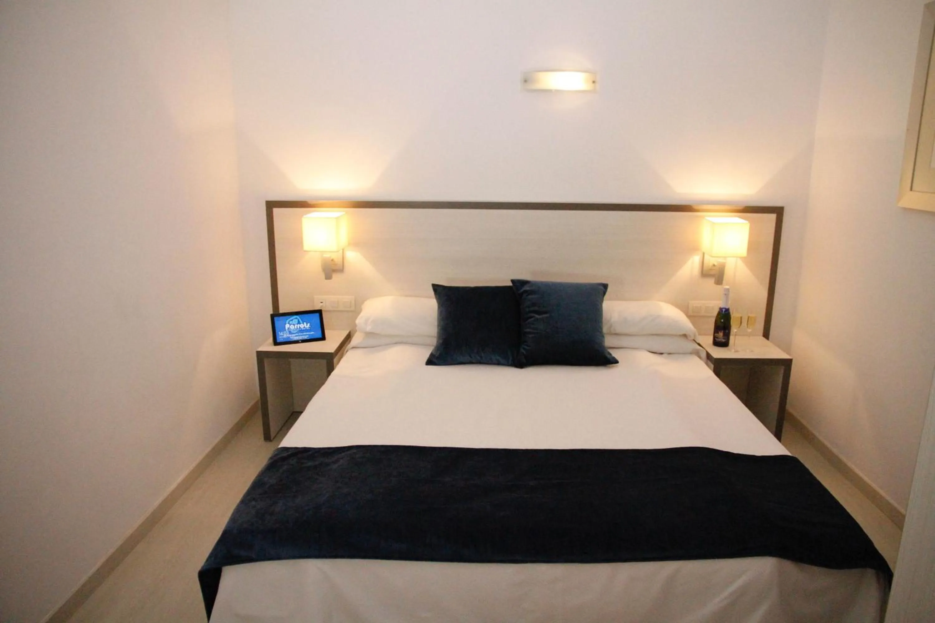 Bed in Parrots Sitges Hotel