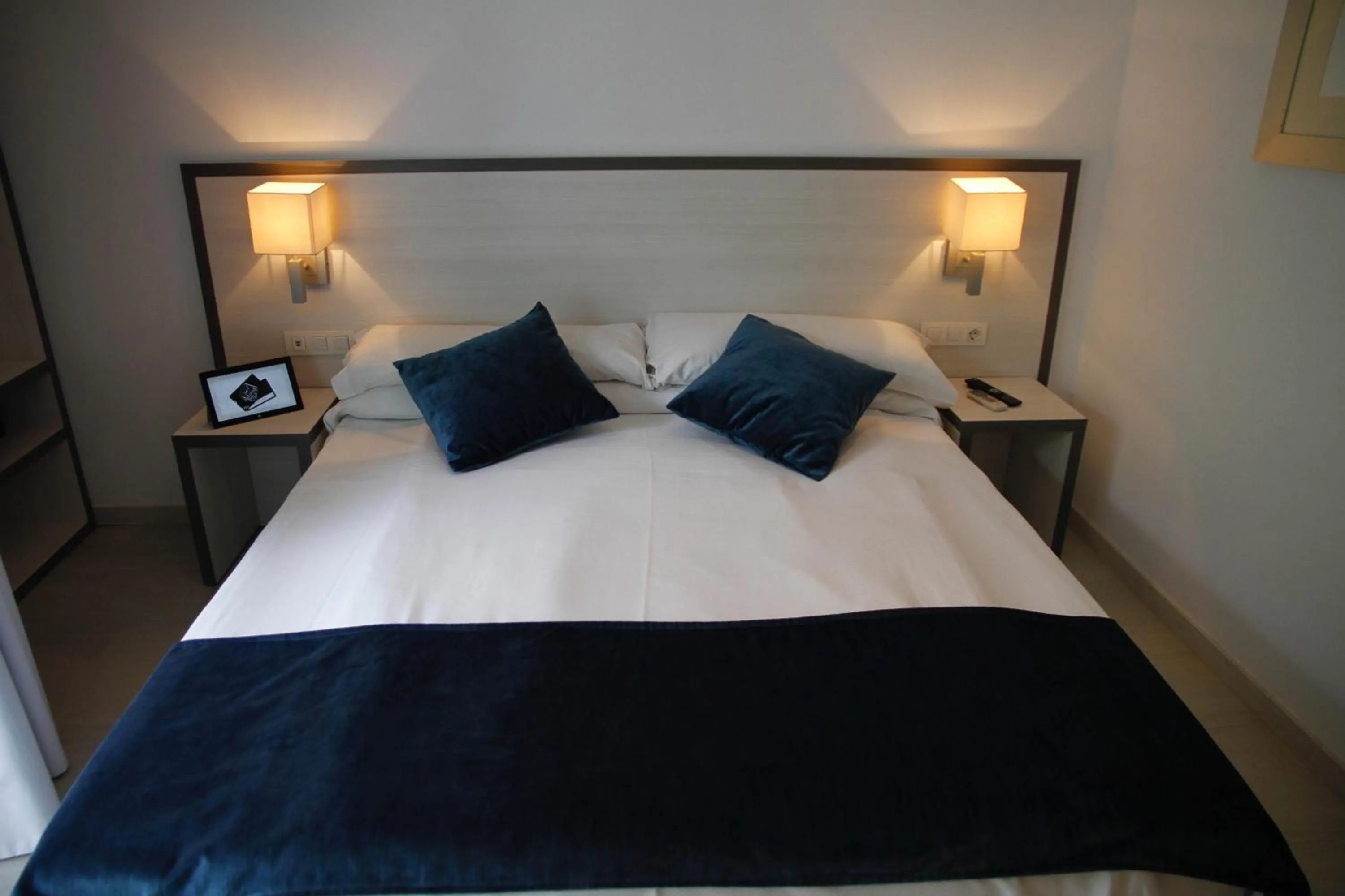 Bed in Parrots Sitges Hotel