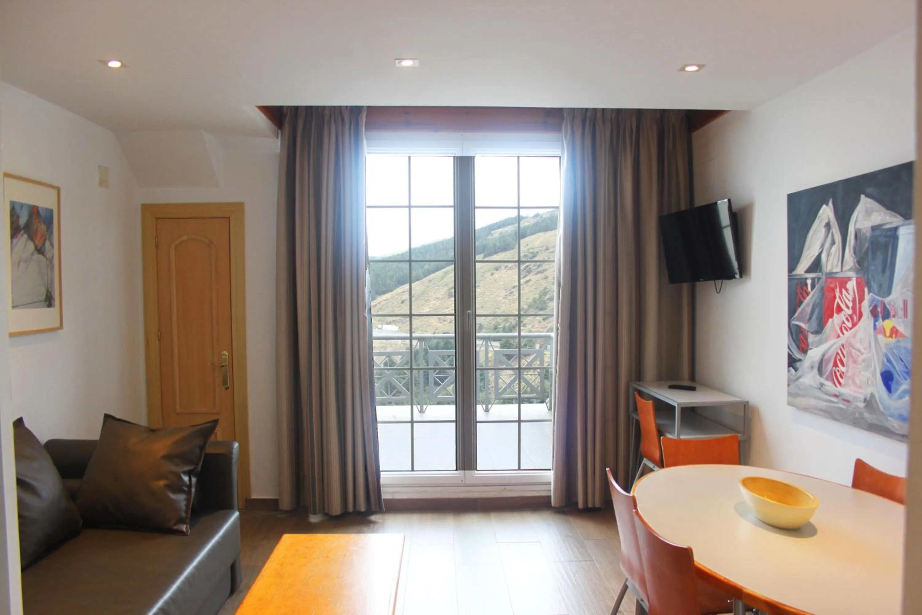 Living room, Bed in Apartamentos Sabica Nevada Plaza