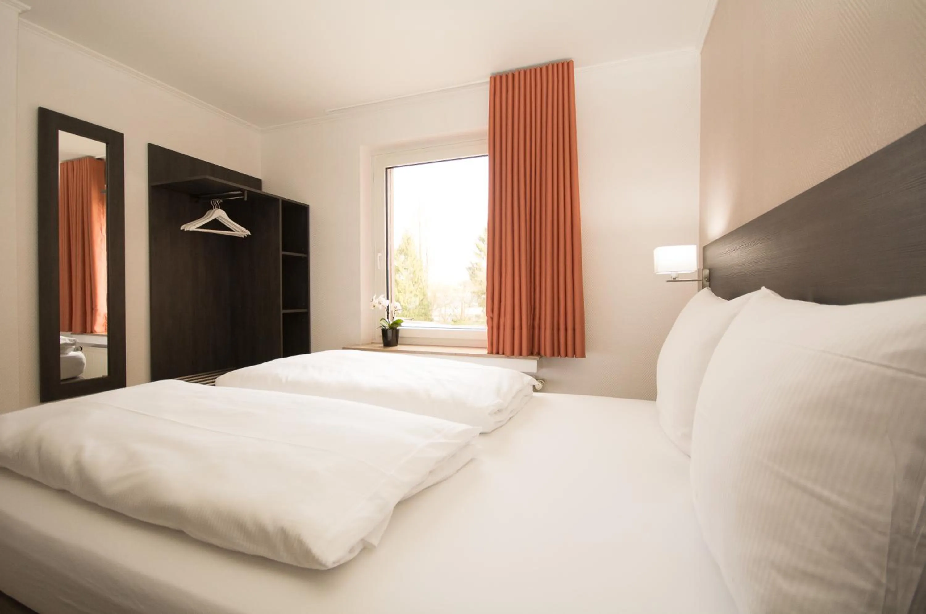 Photo of the whole room, Bed in BIVIUS Hotel Restaurant Luxembourg