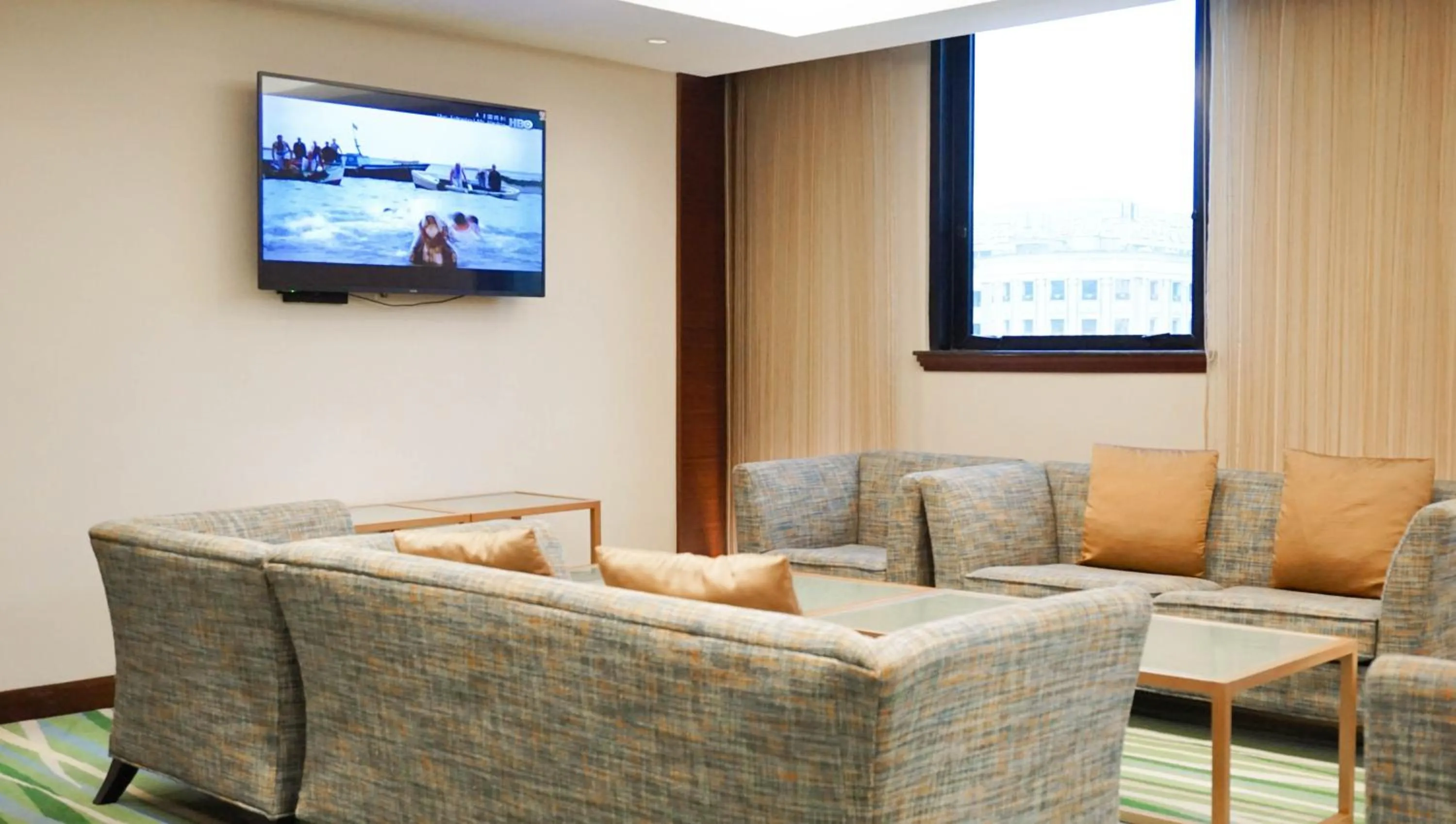 Communal lounge/ TV room in HiONE Holiday Hotel