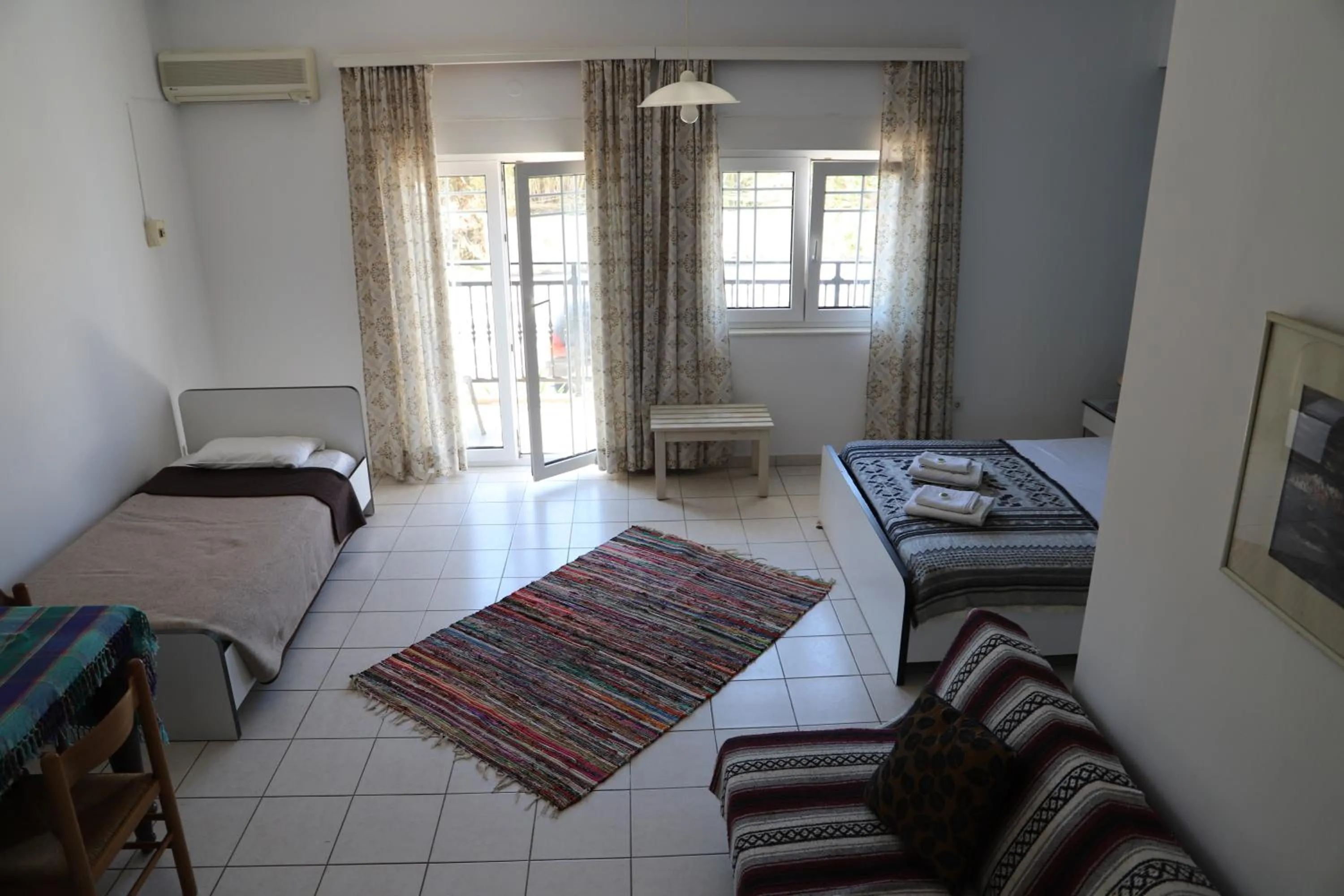 Bed in Aris Apartments