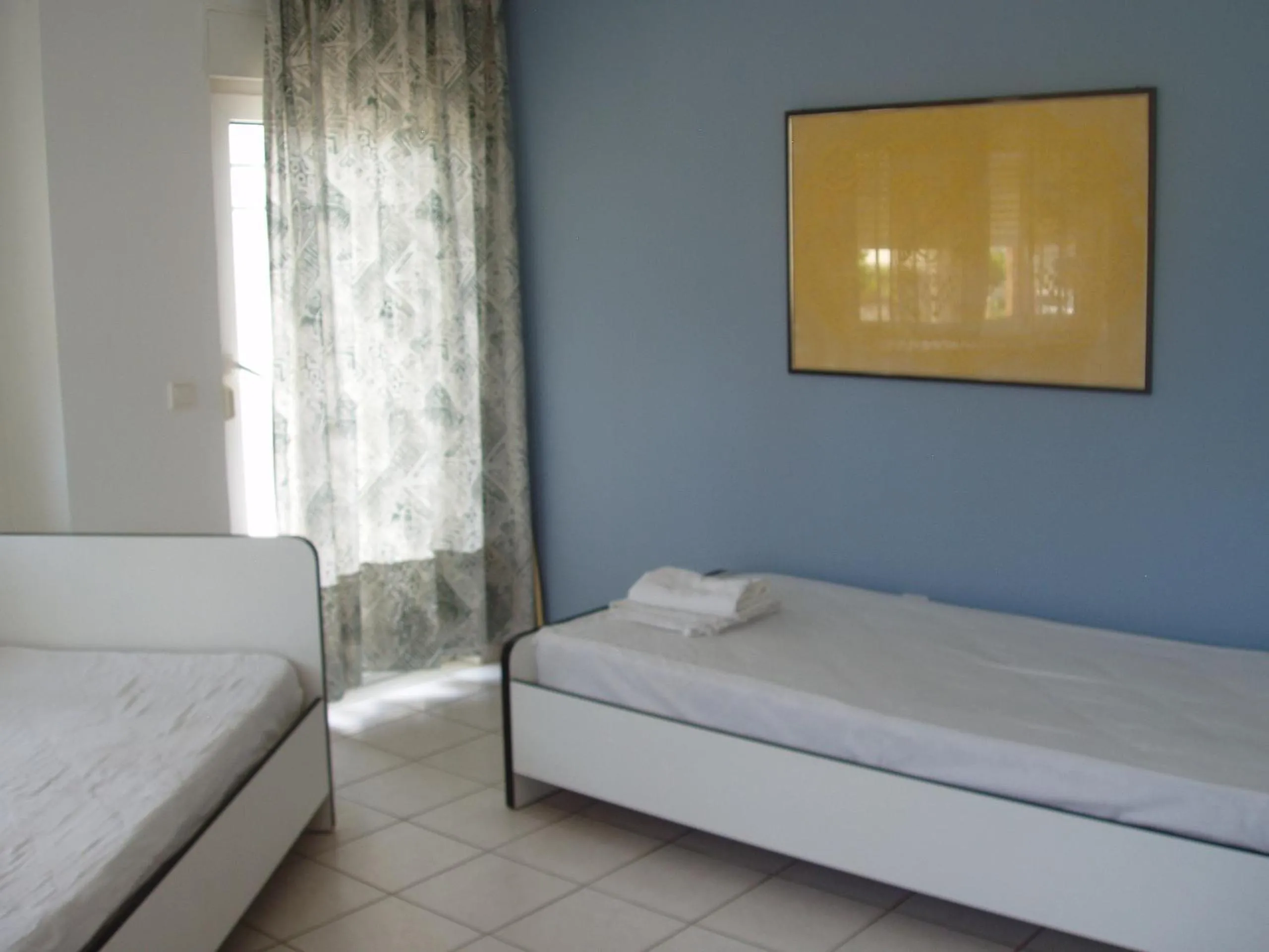 Bed in Aris Apartments