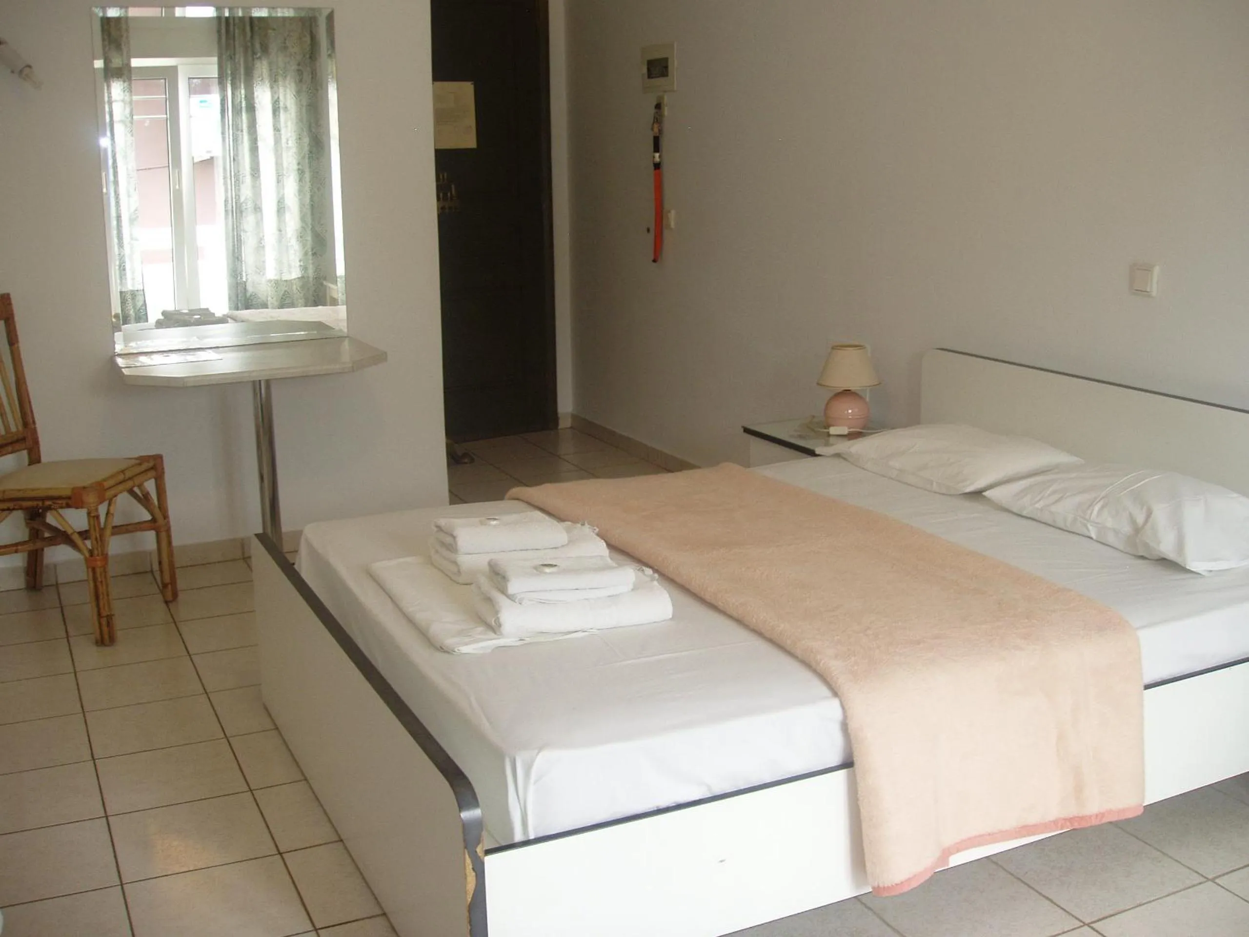 Bed in Aris Apartments
