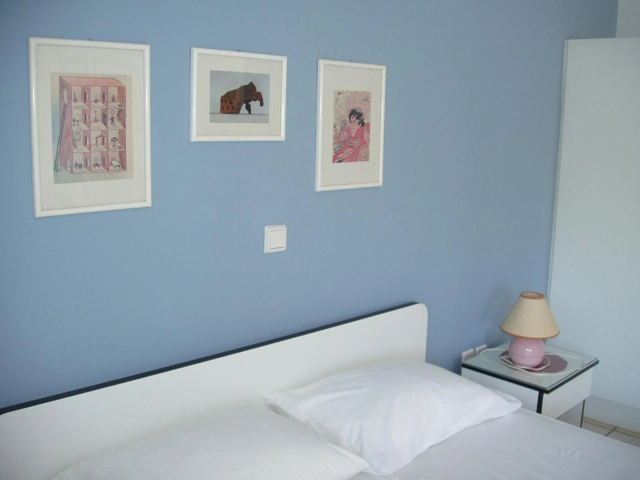 Bed in Aris Apartments