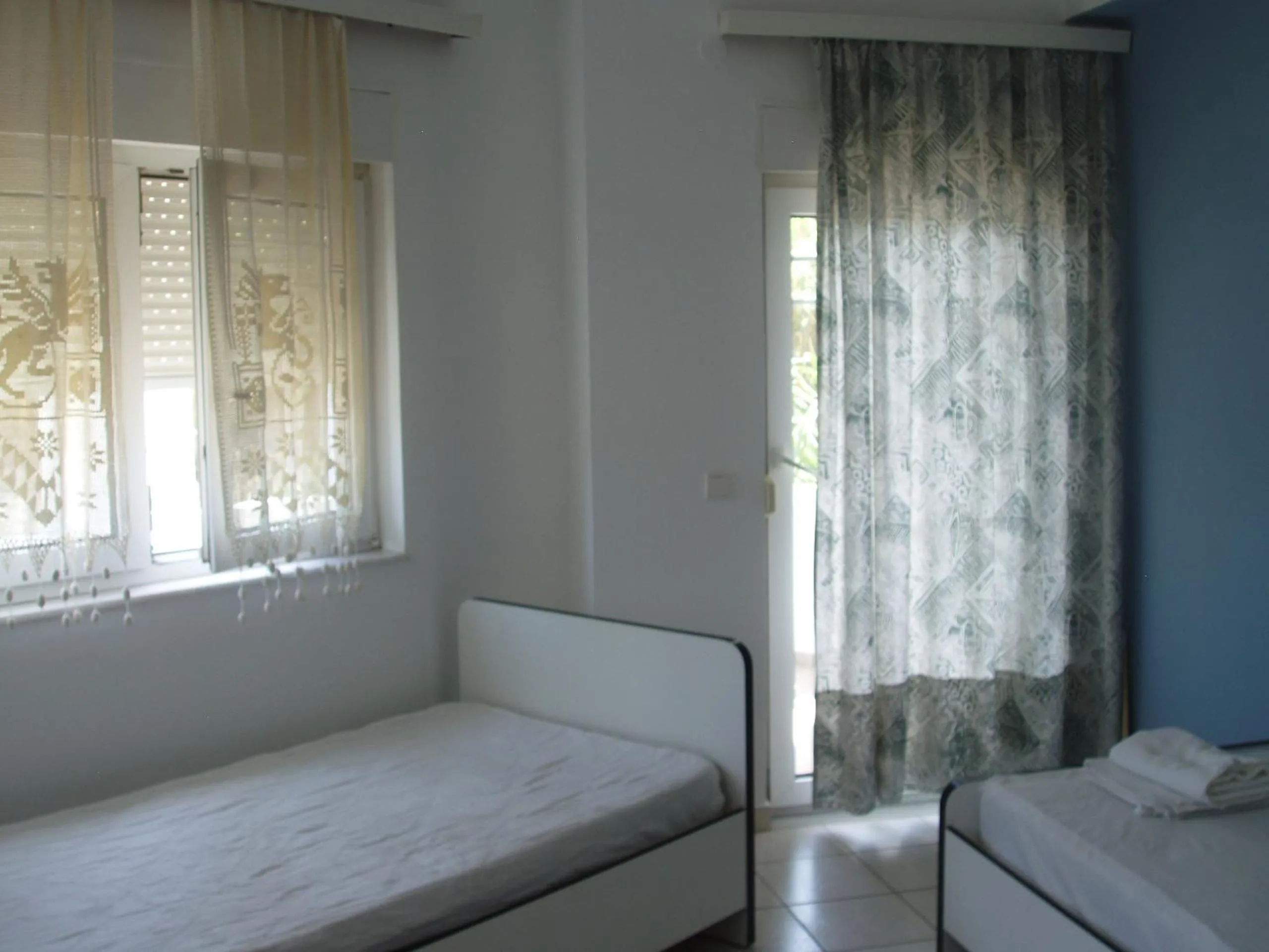 Bed in Aris Apartments