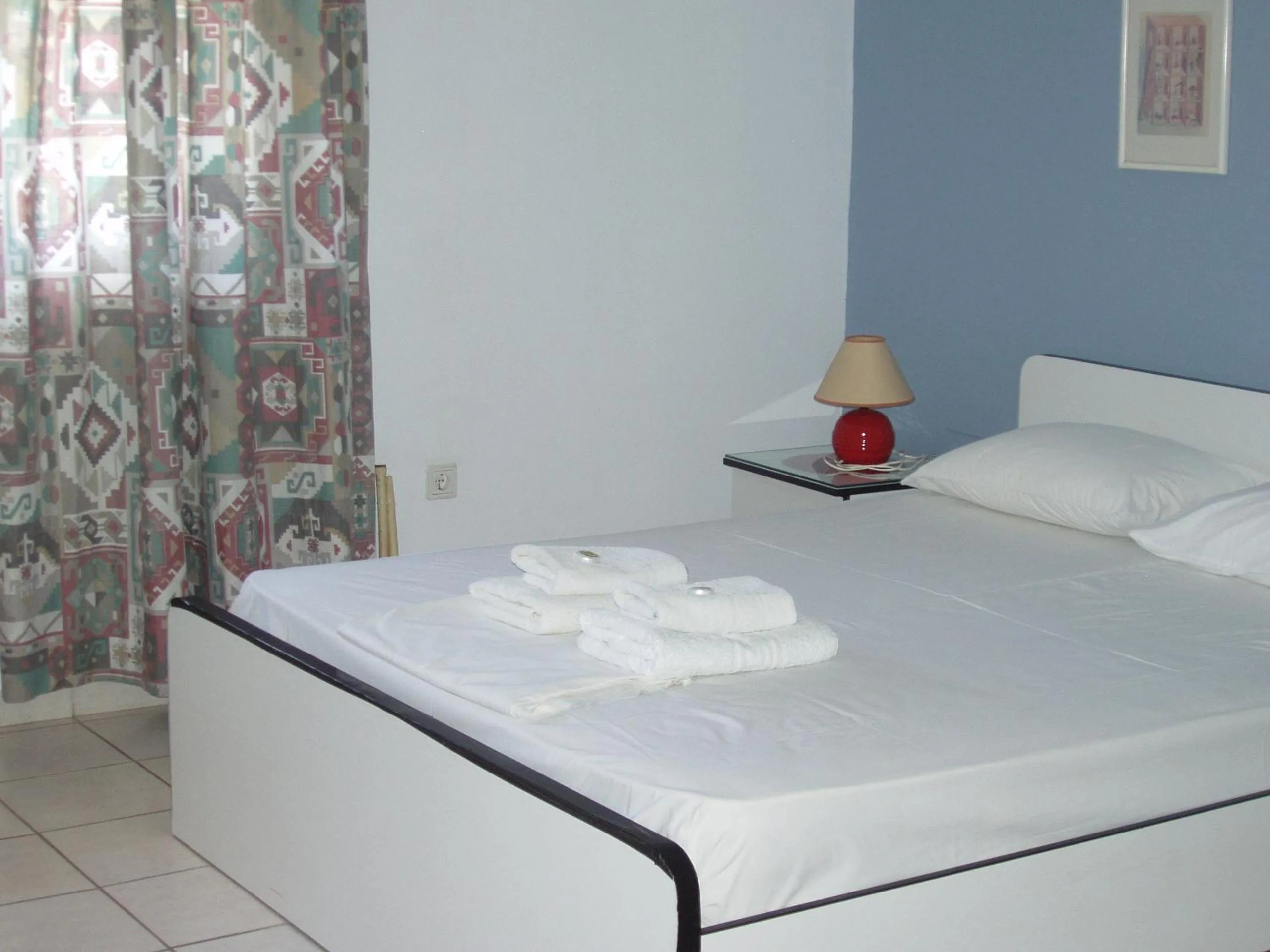 Bed in Aris Apartments