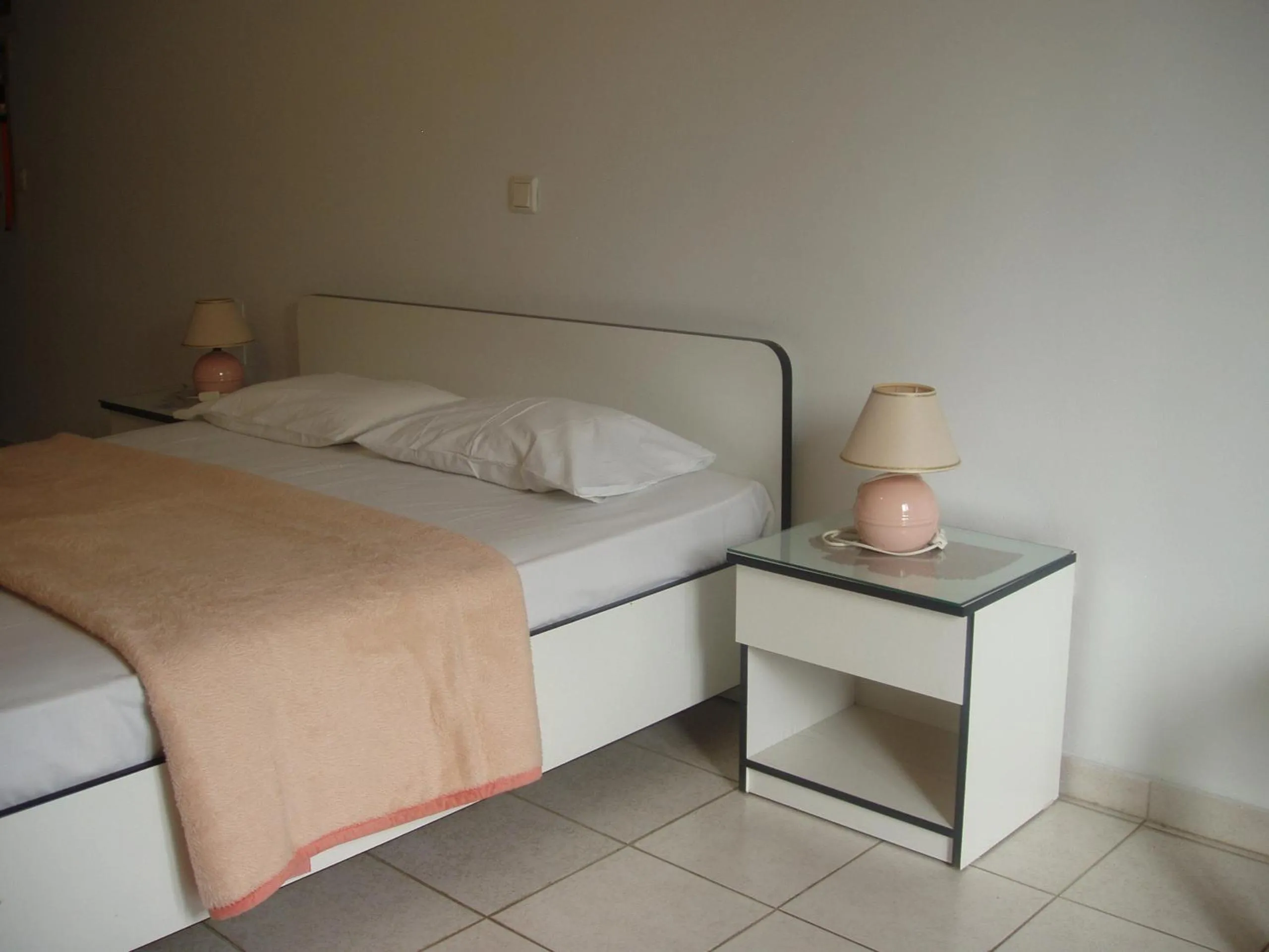 Bed in Aris Apartments
