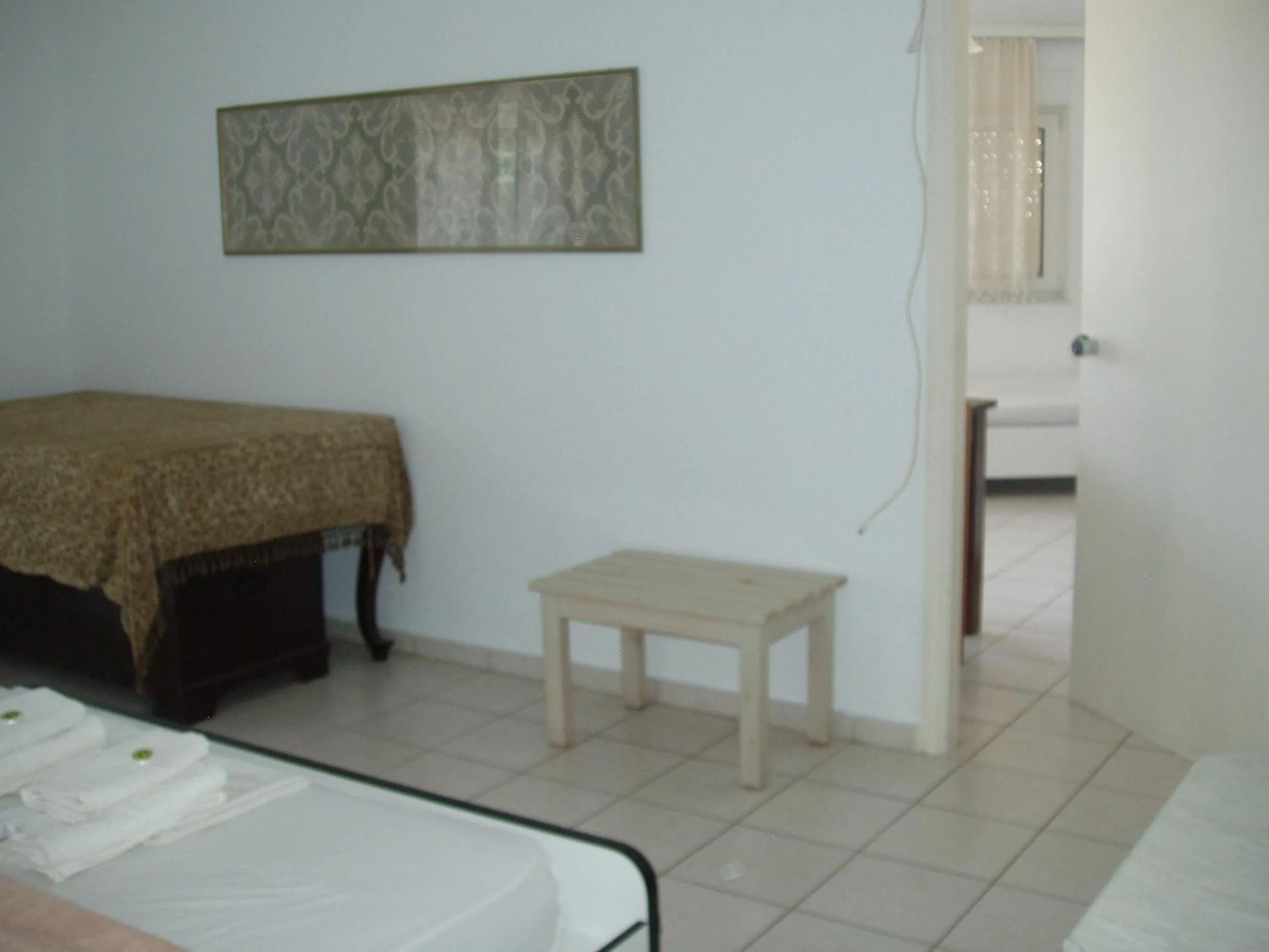 Bed in Aris Apartments