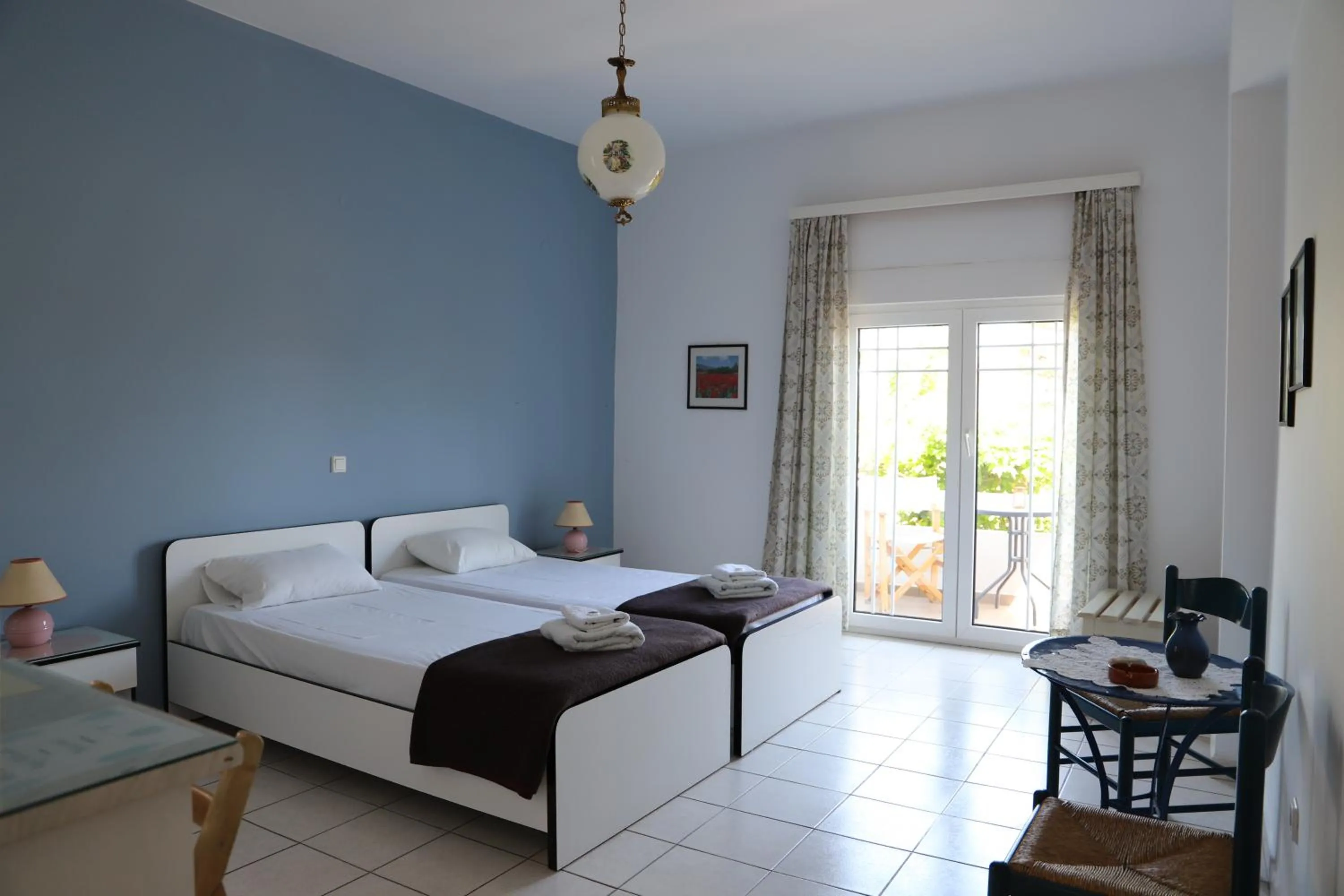 Bed in Aris Apartments