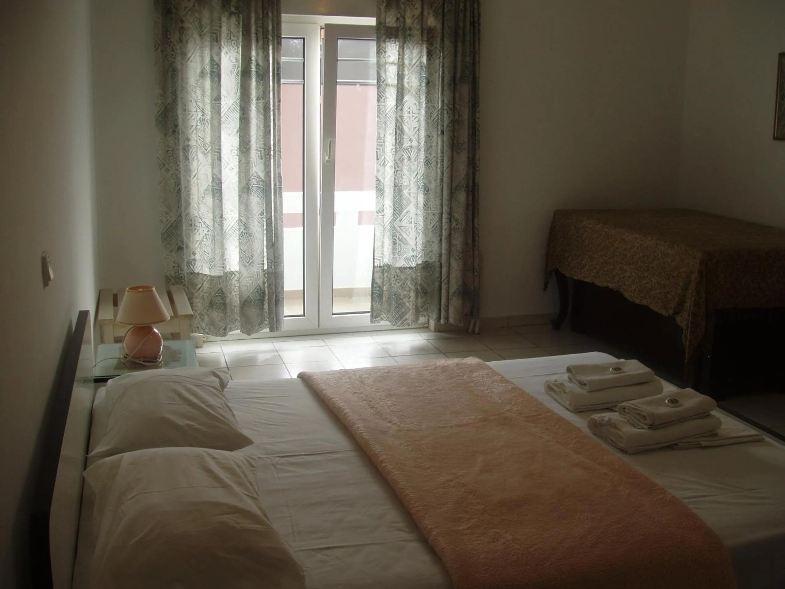 Bed in Aris Apartments