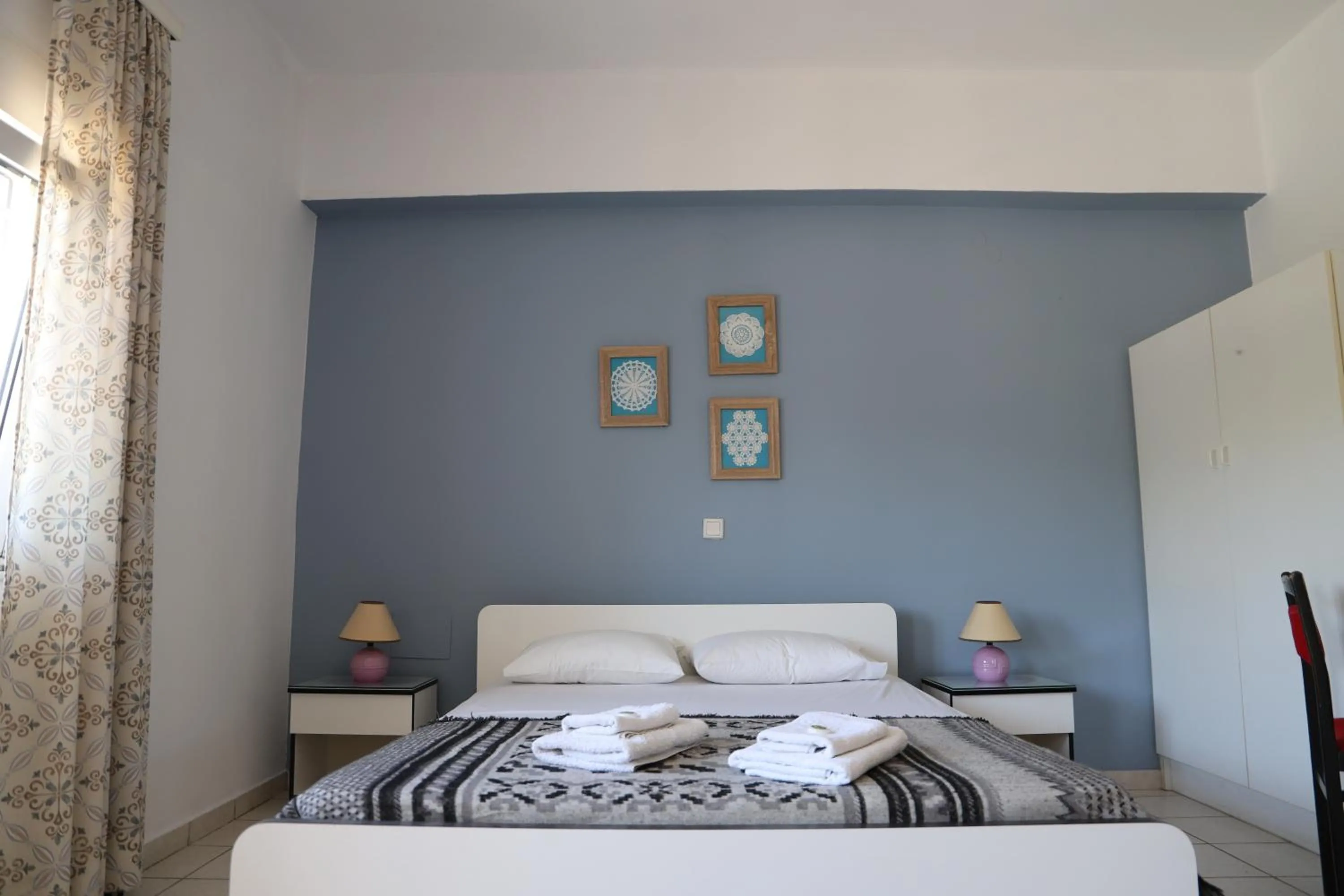 Bed in Aris Apartments
