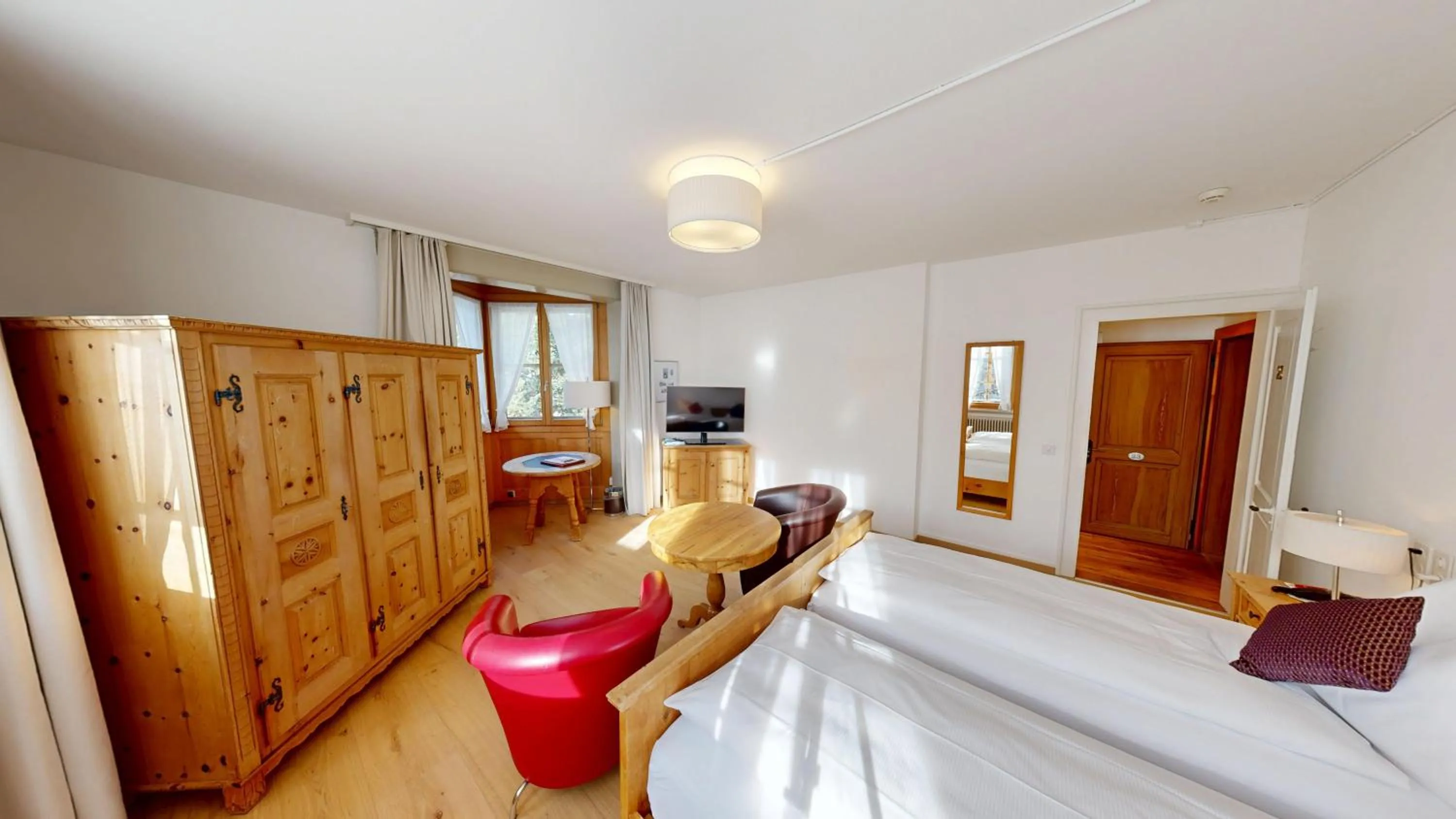 Bed in Schweizerhaus Swiss Quality Hotel