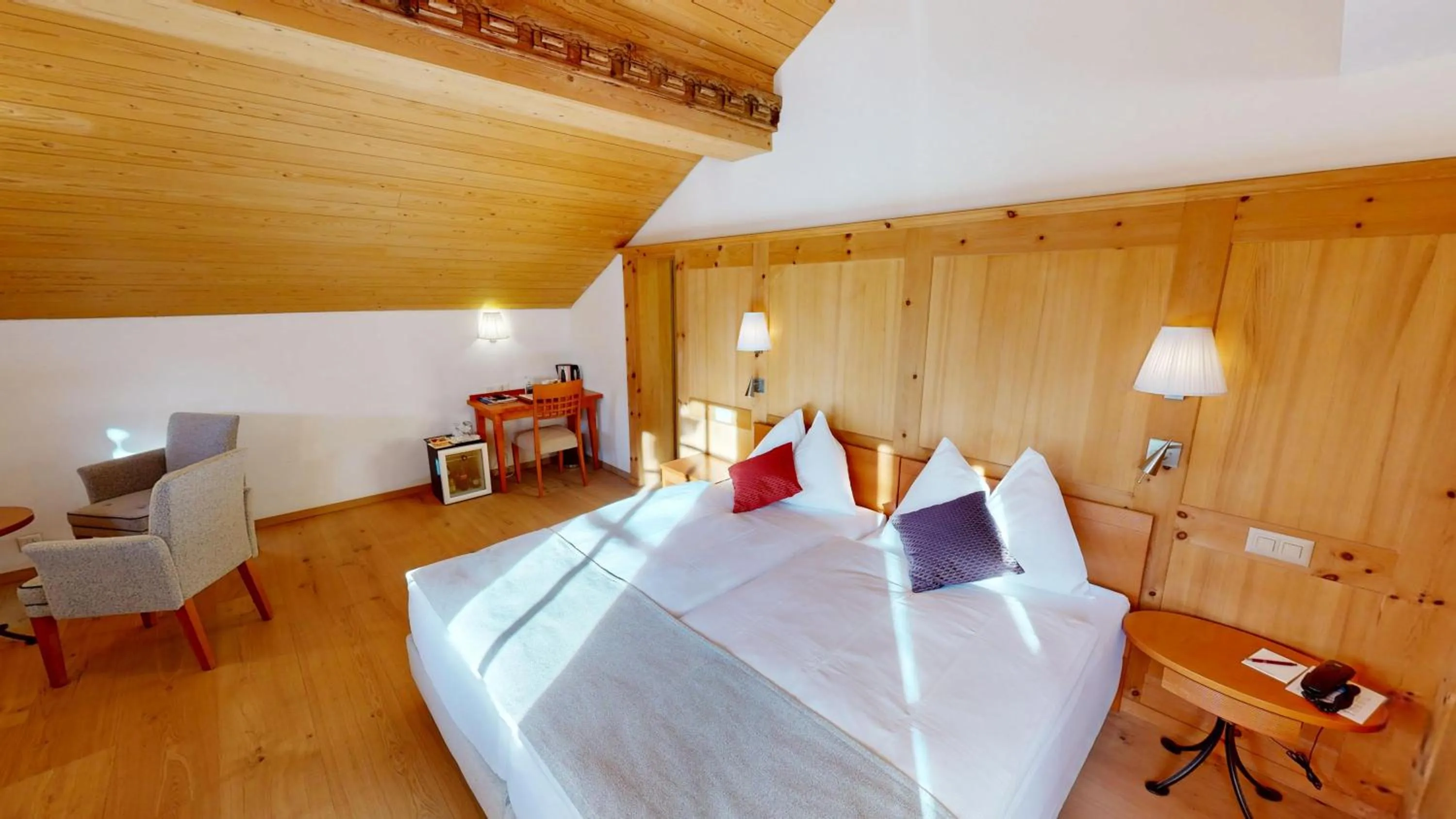 Bed in Schweizerhaus Swiss Quality Hotel