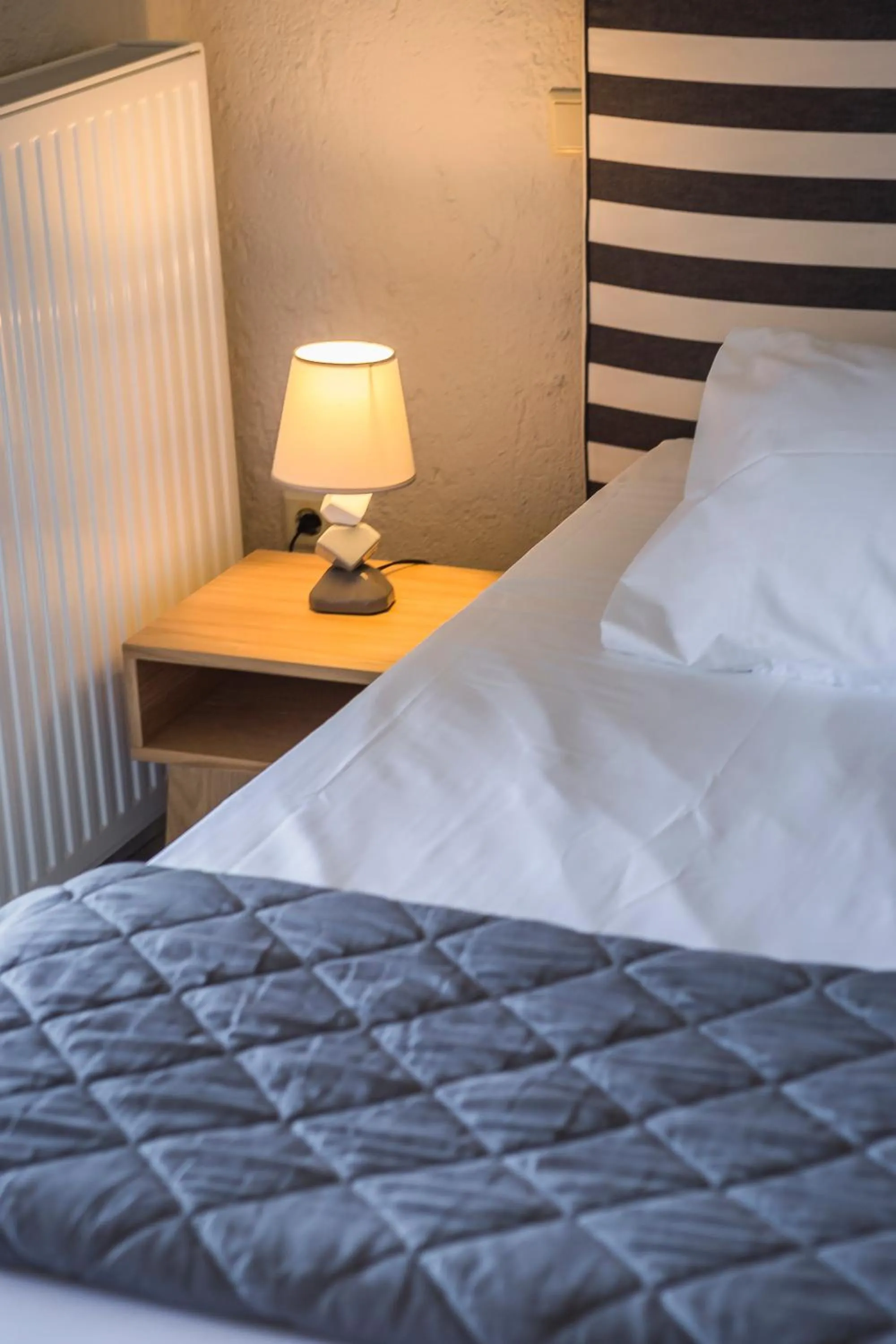 Bed in Panorama Fanari studios and apartments