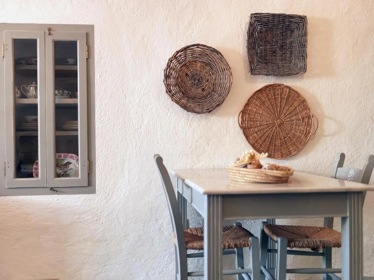 Dining area in AFOURA HOUSES by K&K