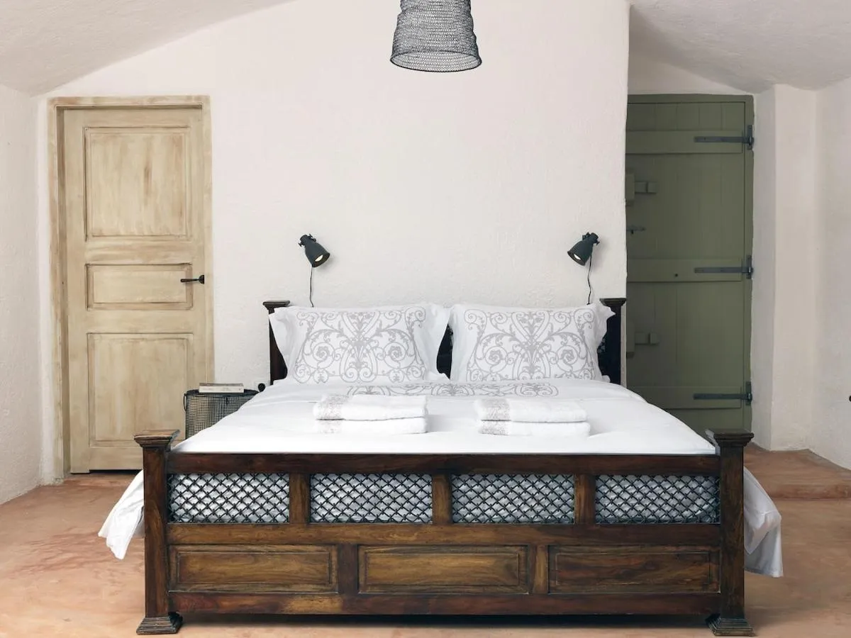 Bed in AFOURA HOUSES by K&K