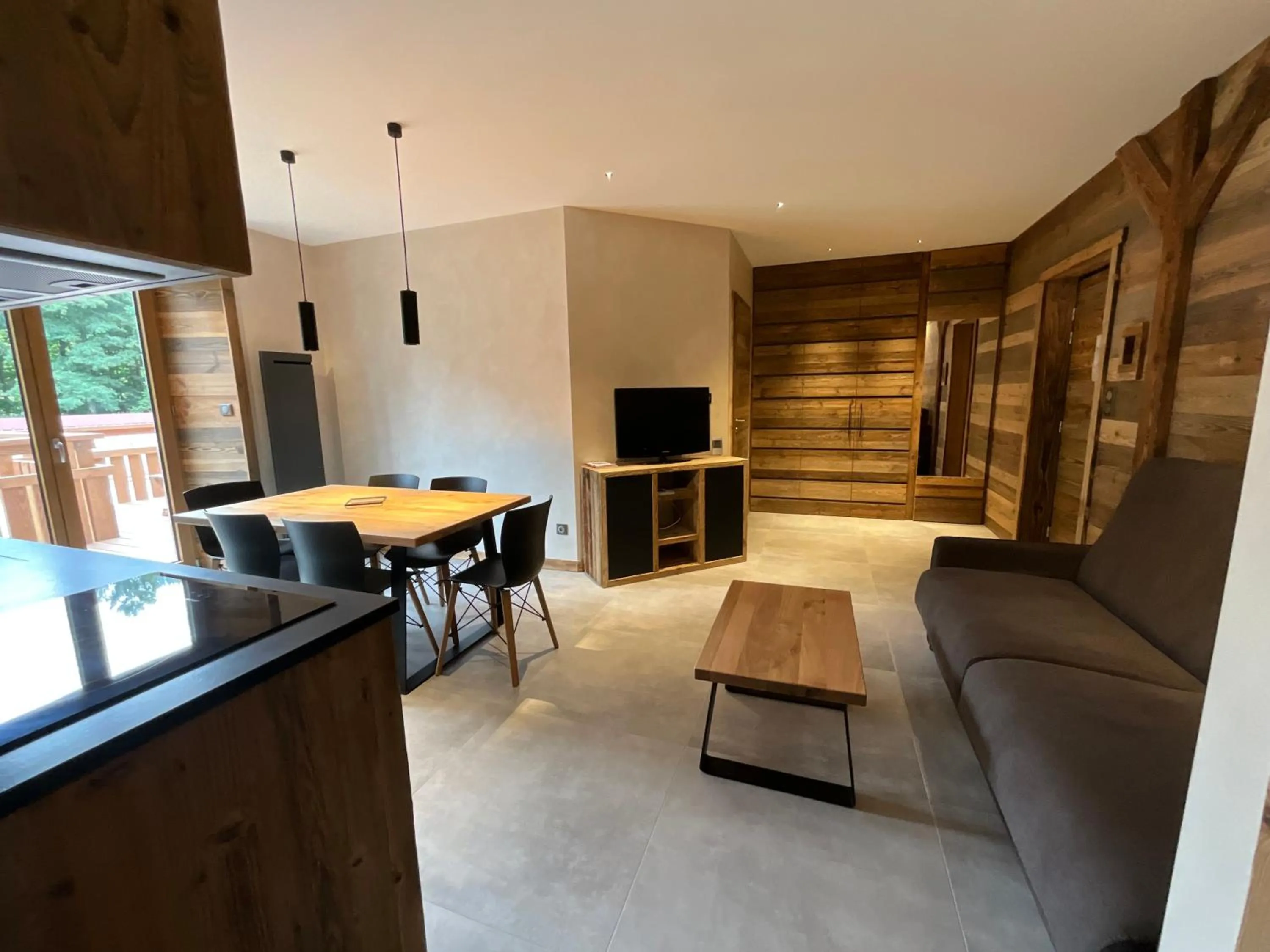 Living room in Gite Roche Des Ducs avec Piscine toute l'année, Spa, Sauna, Hammam