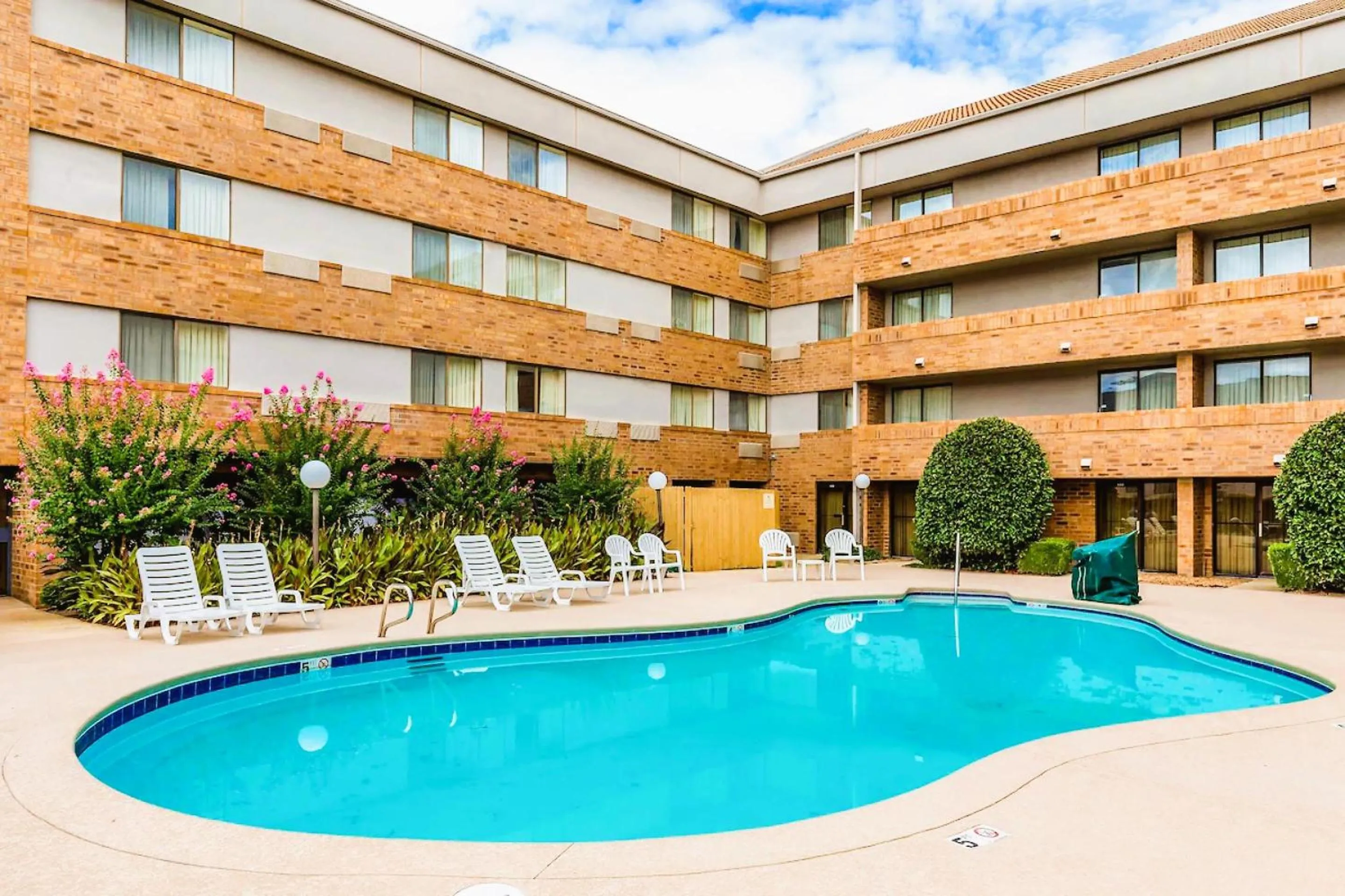 Swimming pool in Tulsa Square Hotel Central, I-44 By OYO