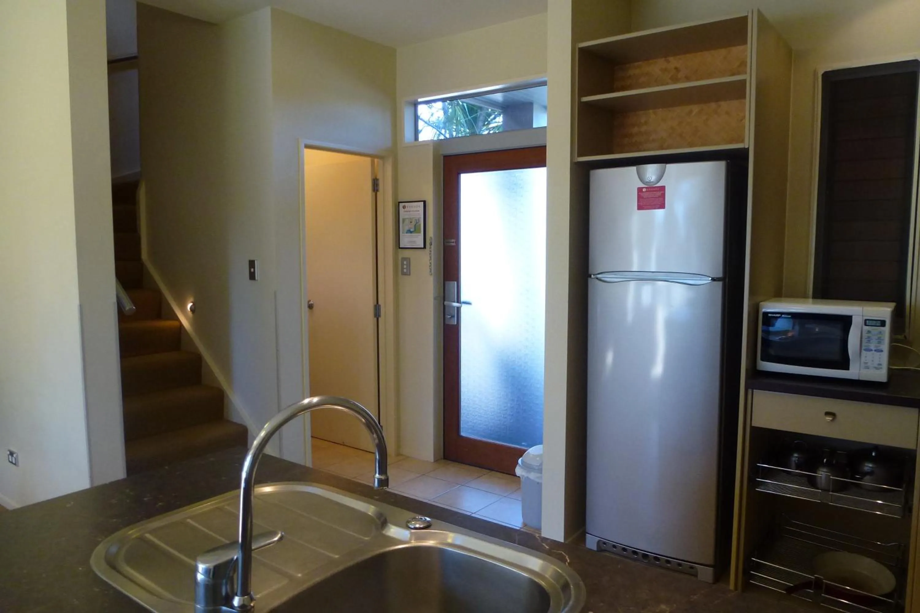 Kitchen or kitchenette in Ramada Resort By Wyndham Rotorua Marama