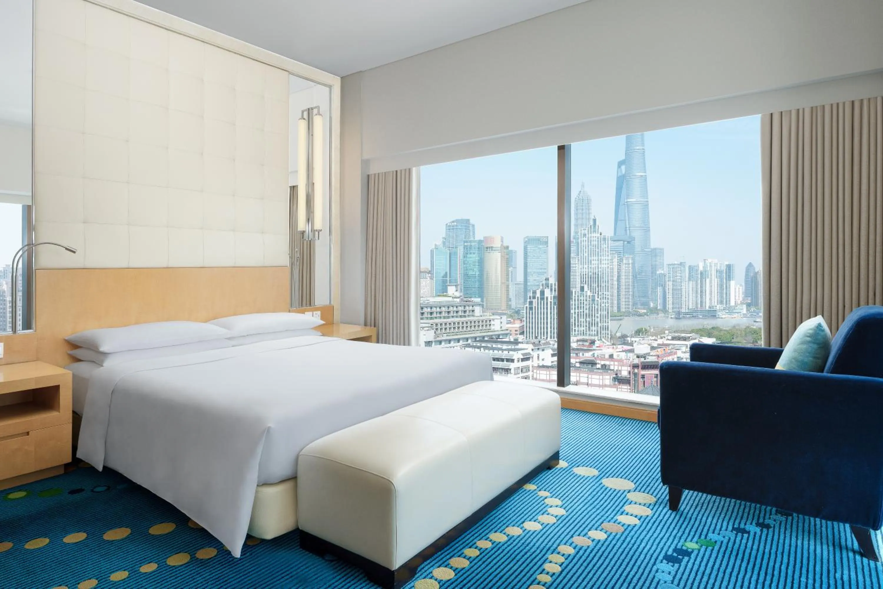 Bed in Renaissance Shanghai Yu Garden Hotel on the Bund